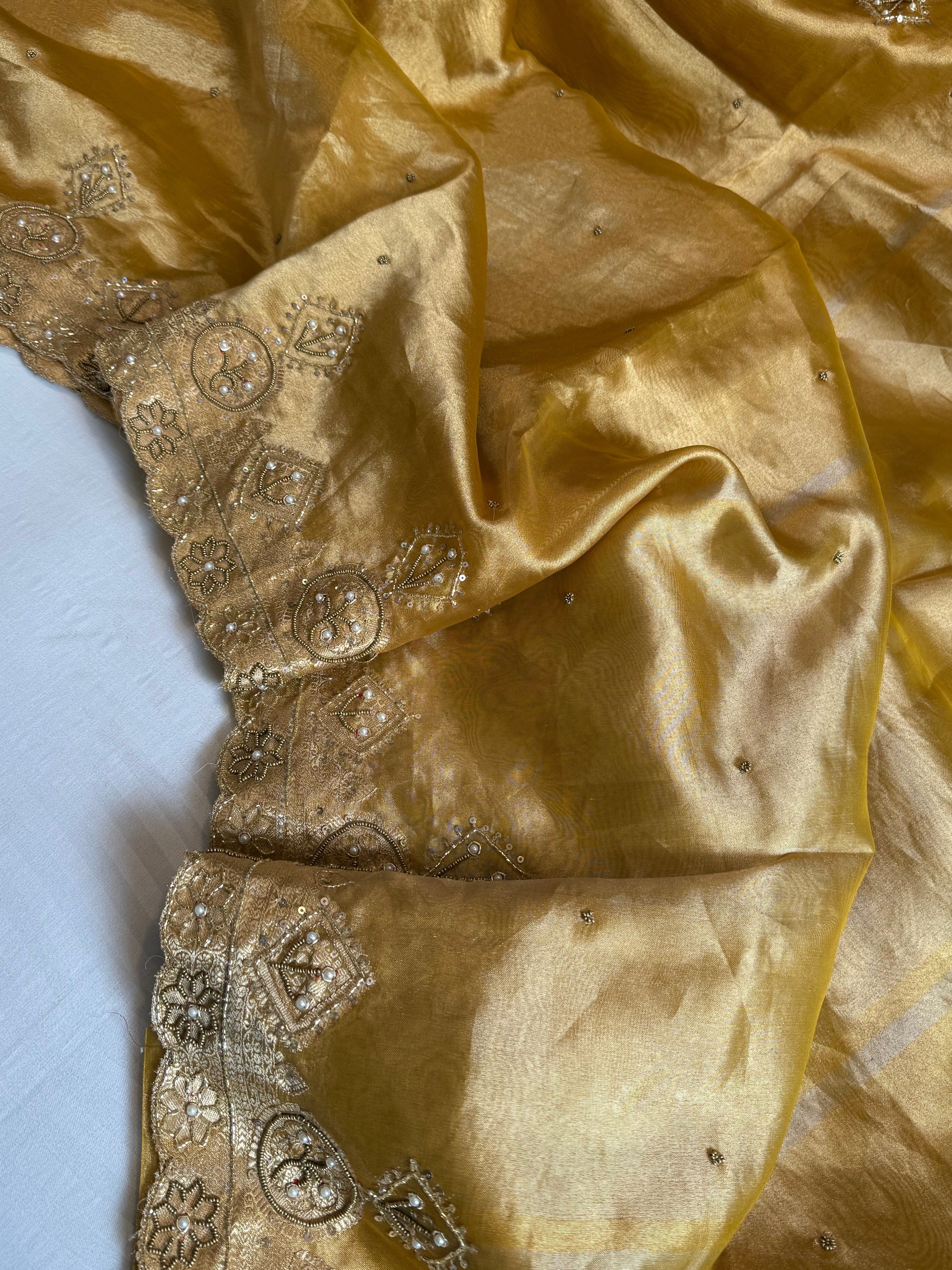 Husn golden yellow tissue silk heavy zardozi hand embroidered saree