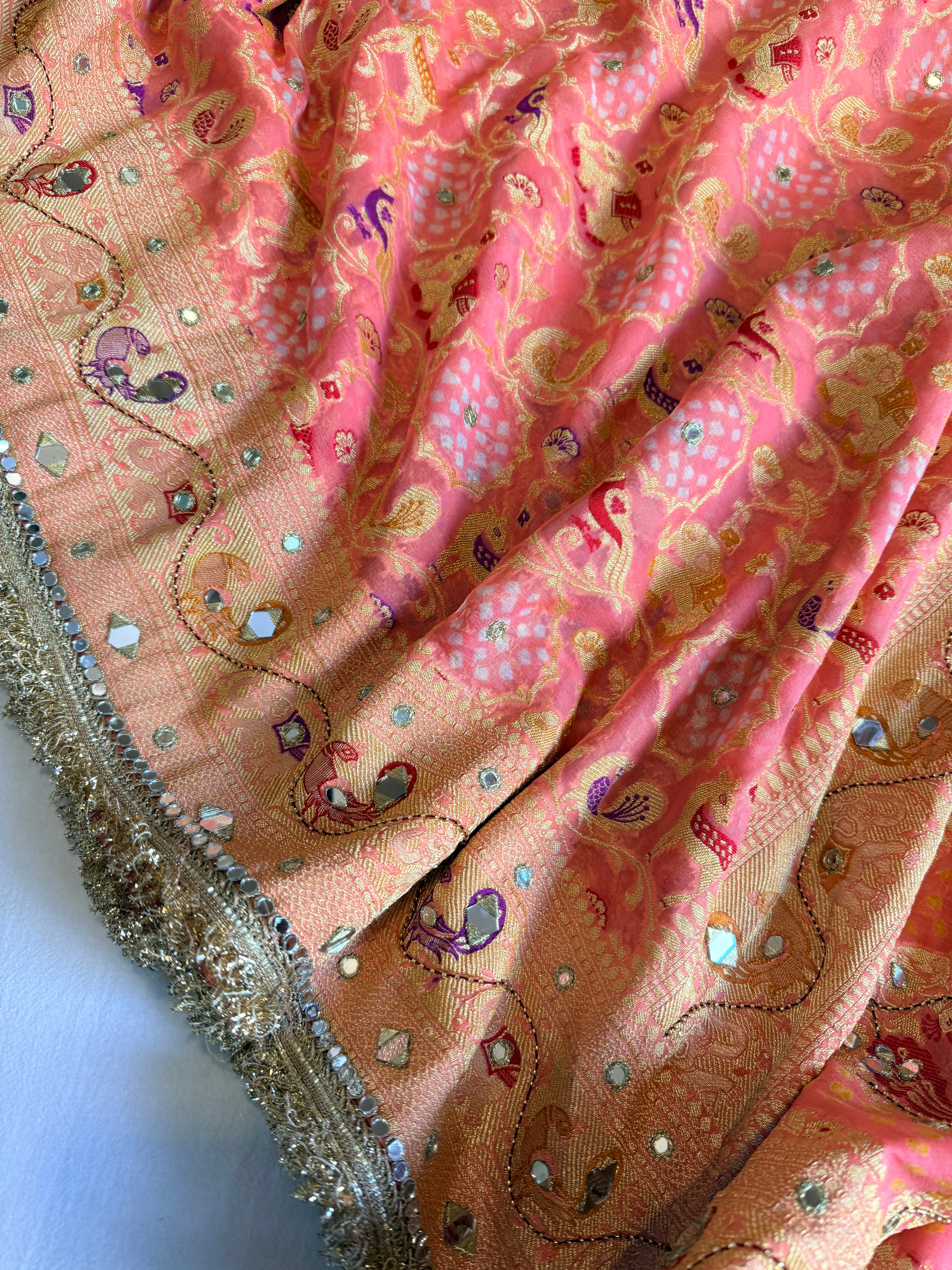 Banarasi blush shades of chiffon rai bandhej mirror work hand embroidered saree