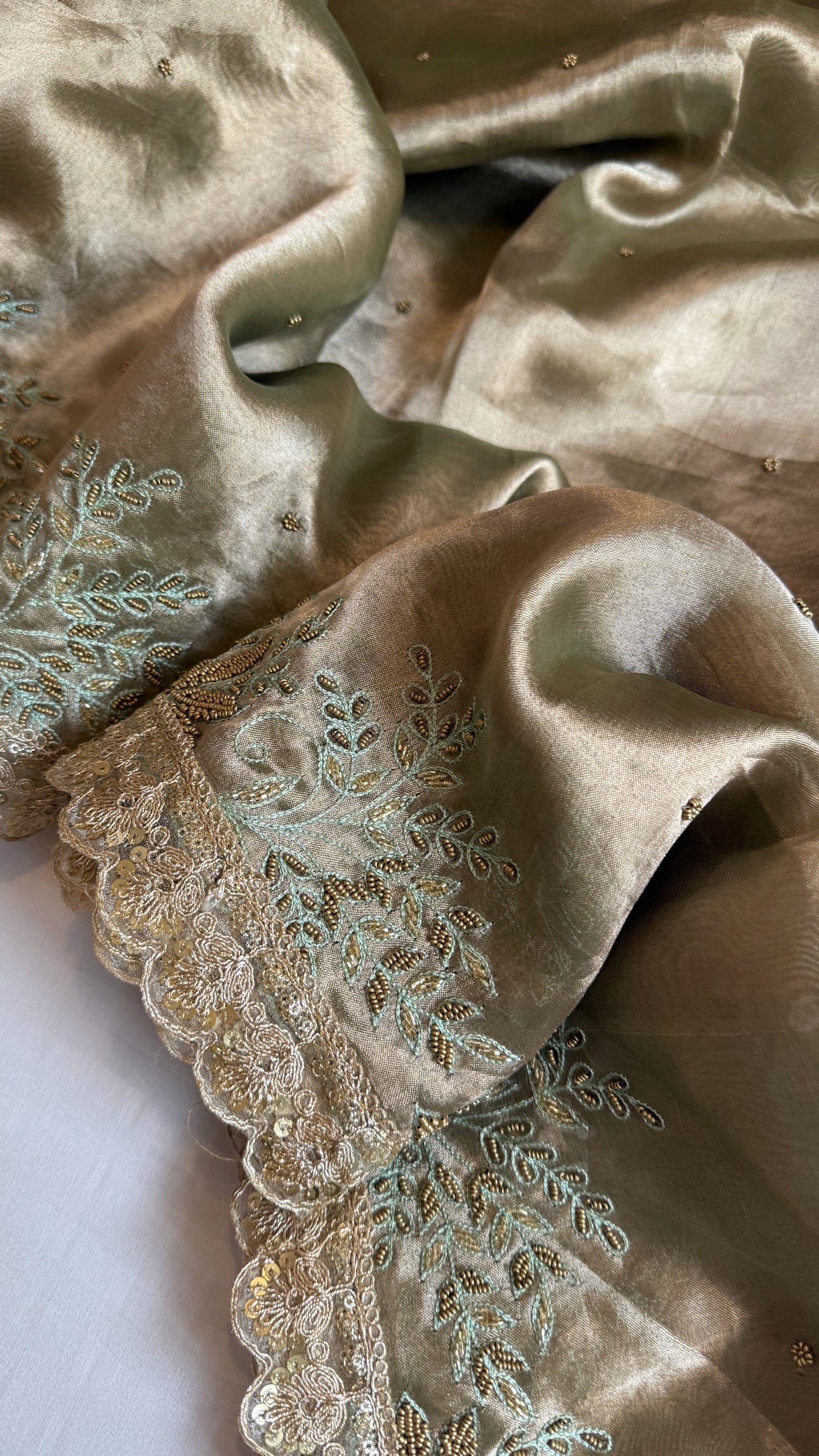 Husn tissue silk sage green heavy zardozi hand embroidered saree