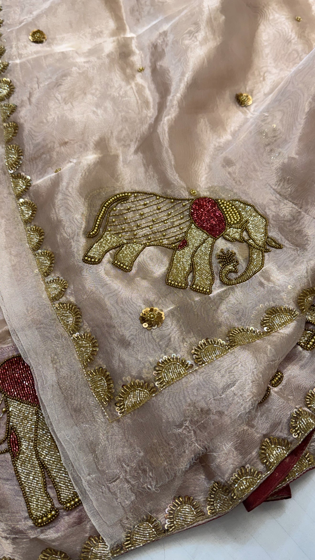 Gajgamini diamond tissue silk light rose gold zari elephant motif hand embroidered lehenga sets