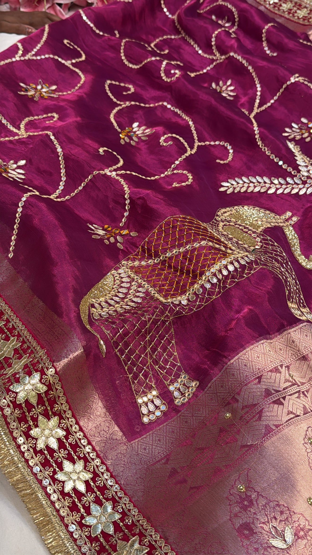 Rani pink husn tissue silk elephant motif hand embroidered saree