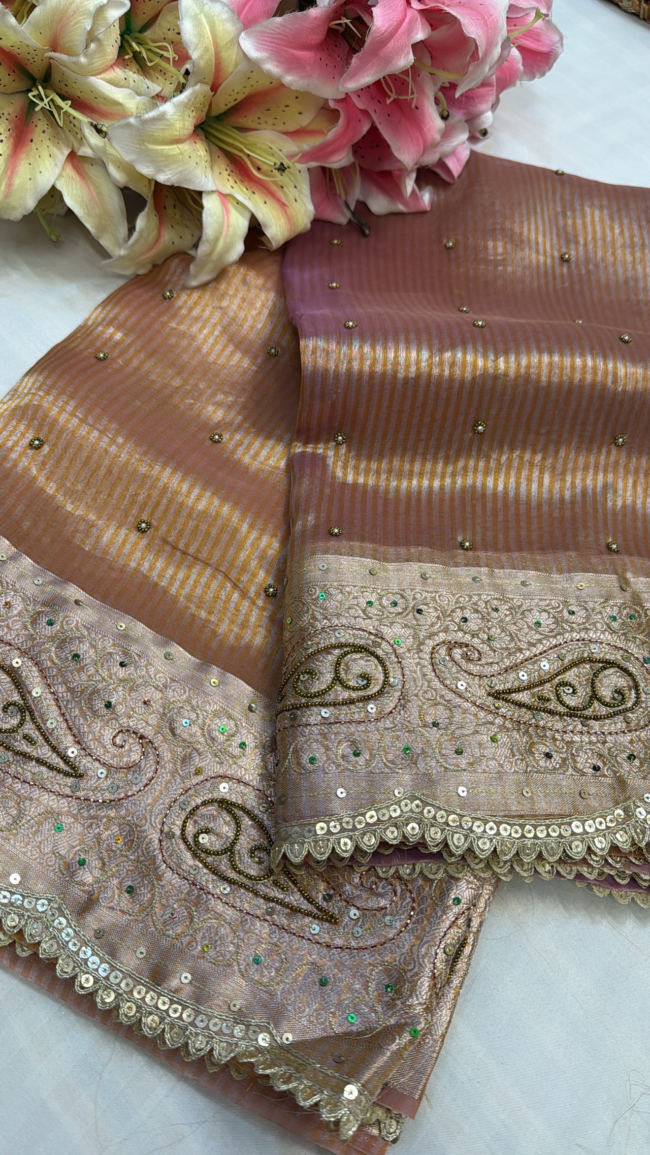 Peachish-pink ombre shaded tissue silk hand embroidered saree
