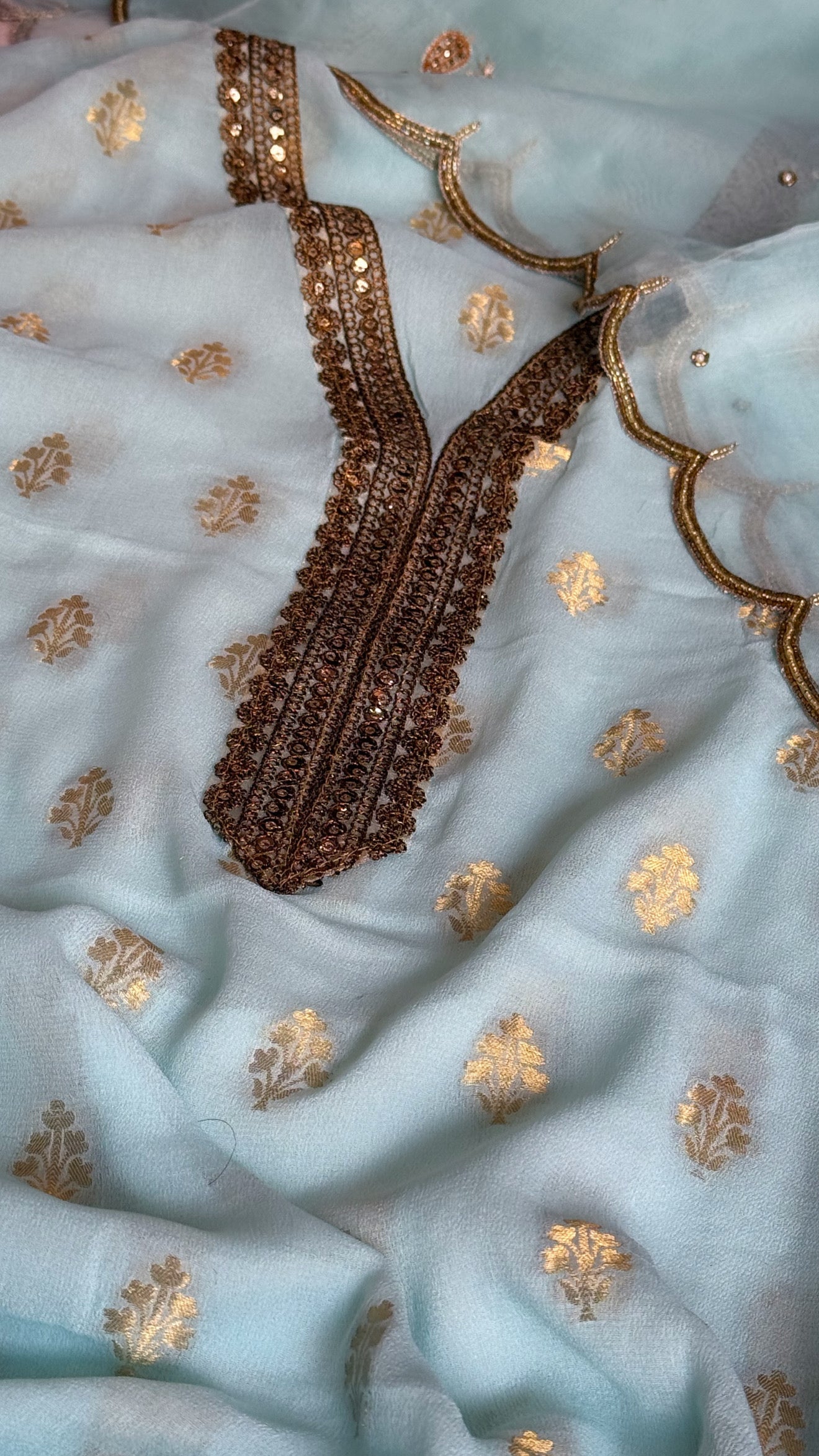 Ice blue banarasi gorgette kadhwa buti kurta paired with toy hathi motif hand embroidered kora duppata