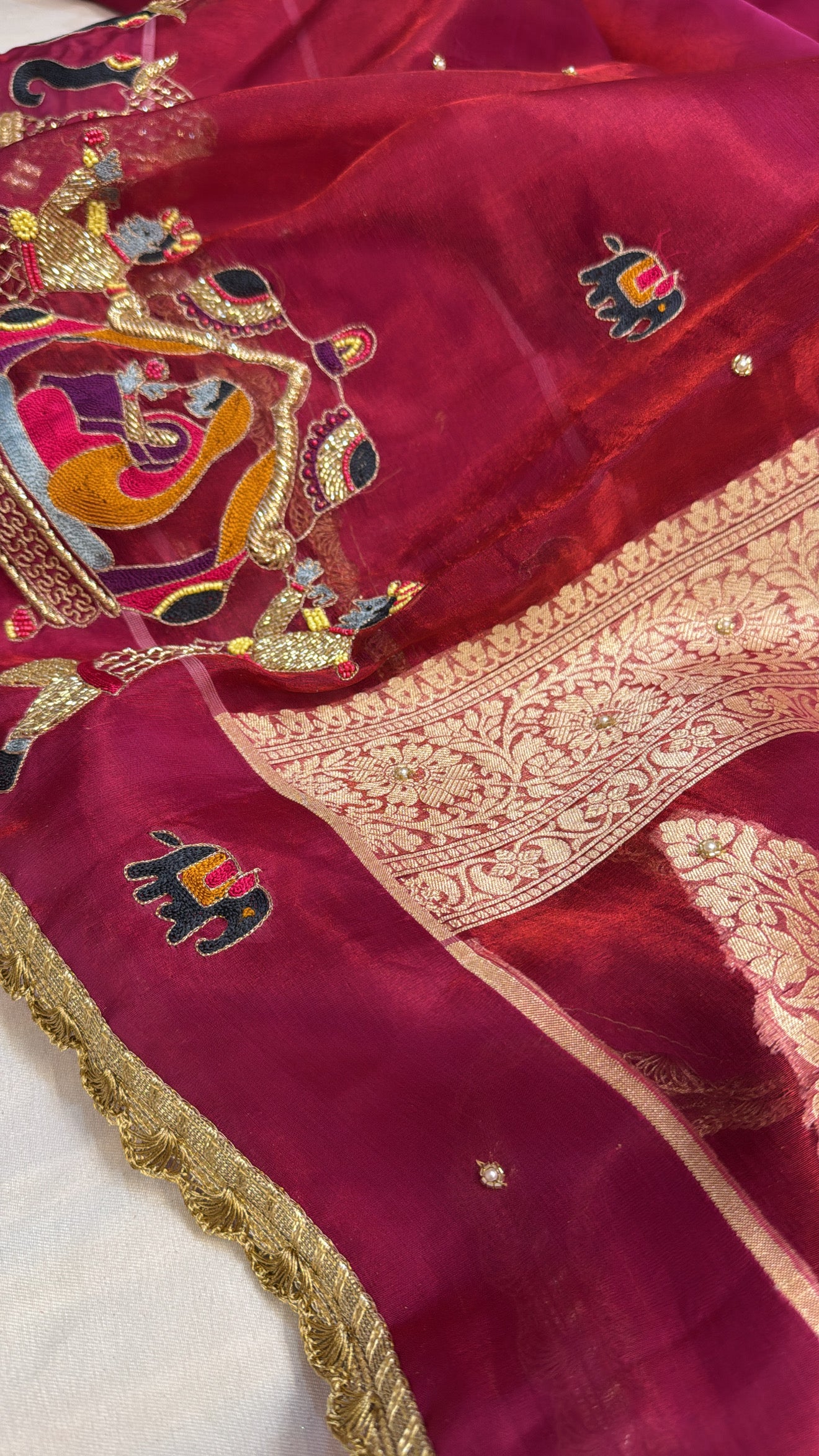 Husn metallic cherry red tissue silk hand embroidered saree