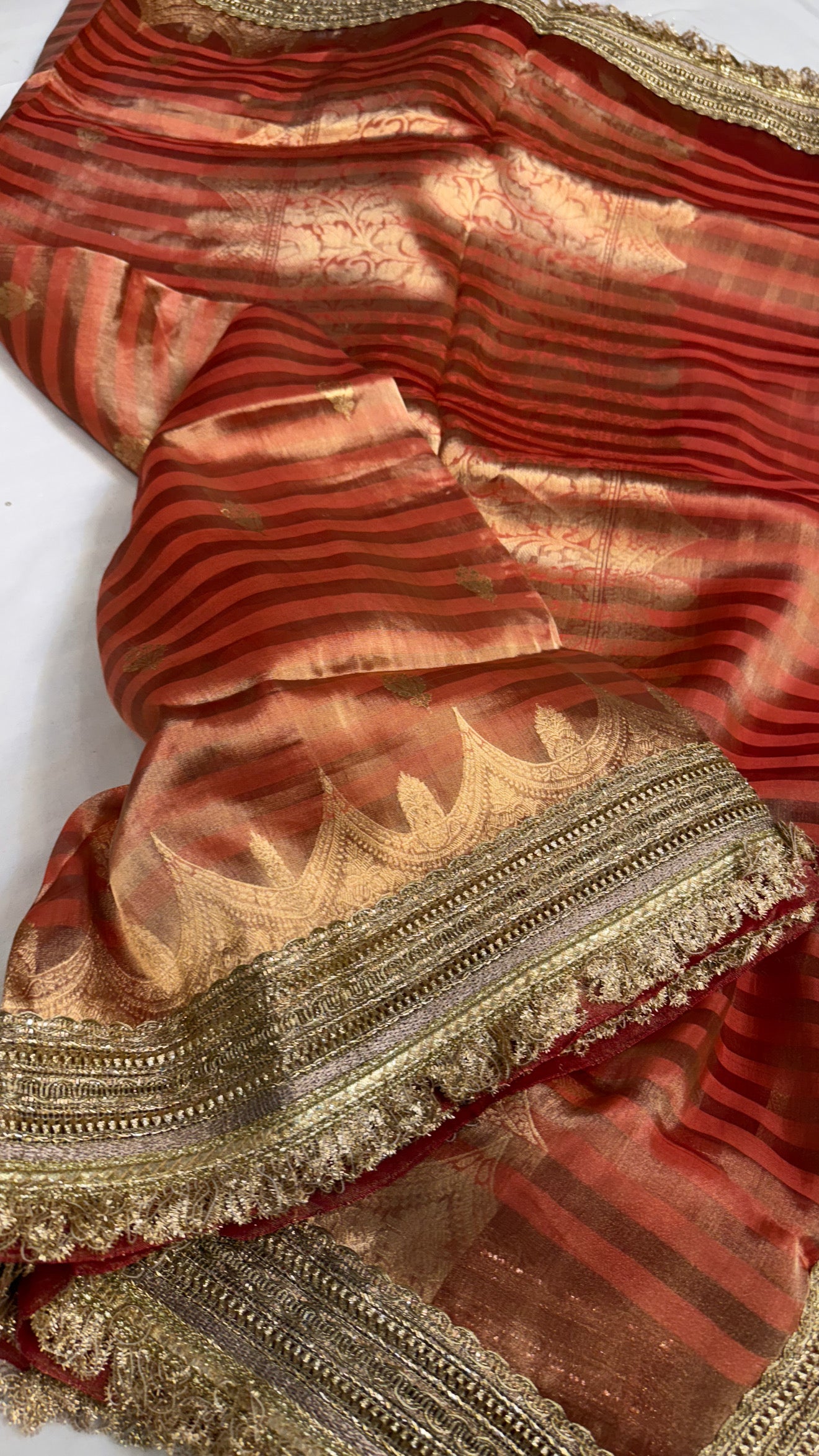 Maharani rust red tissue silk striped kadhwa saree
