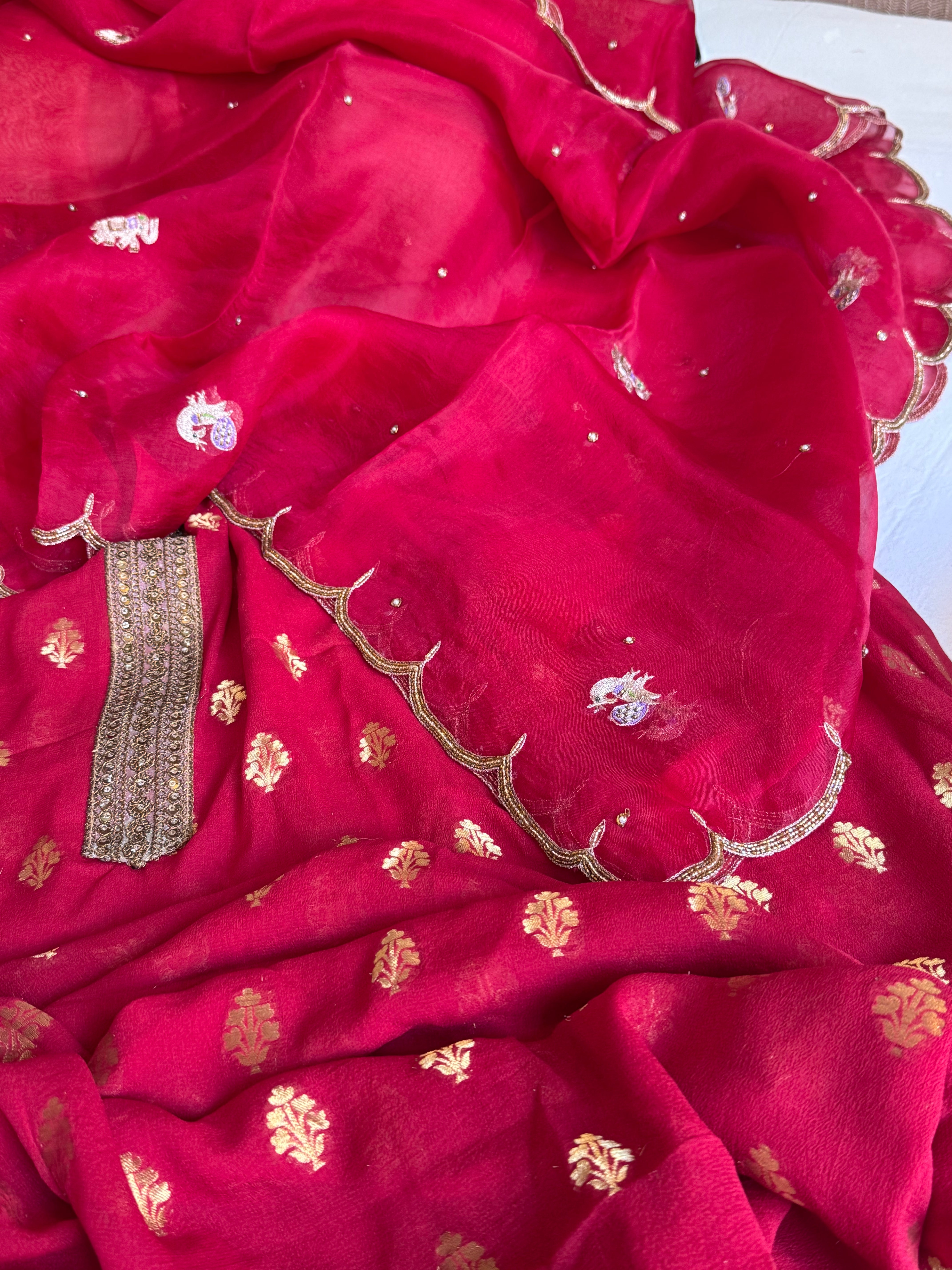 Crimson red banarasi gorgette kadhwa buti kurta paired with toy hathi motif kora silk scalloped duppata set