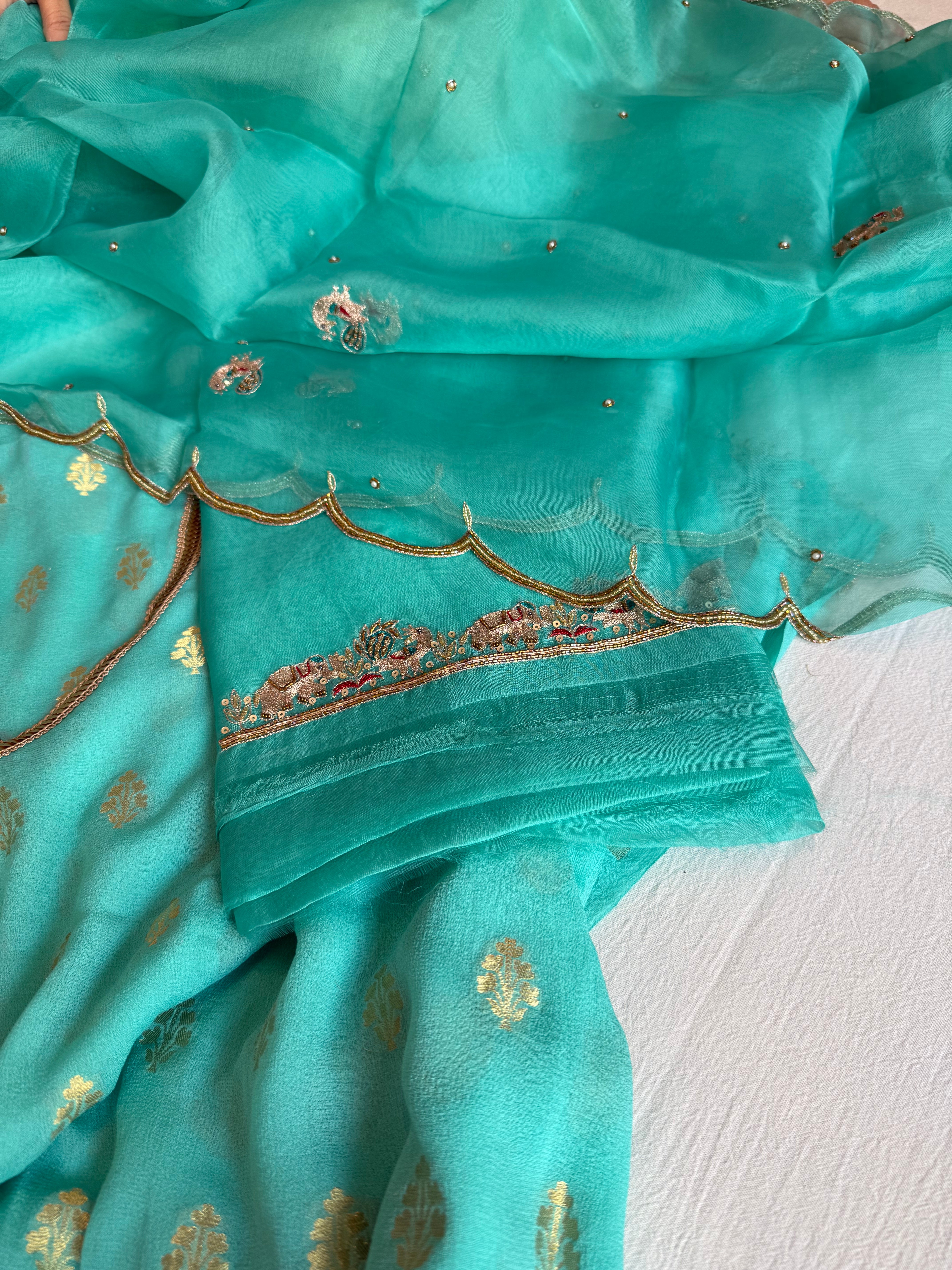 Rama blue banarasi gorgette kadhwa buti kurta paired with toy hathi motif hand embroidered scalloped duppata