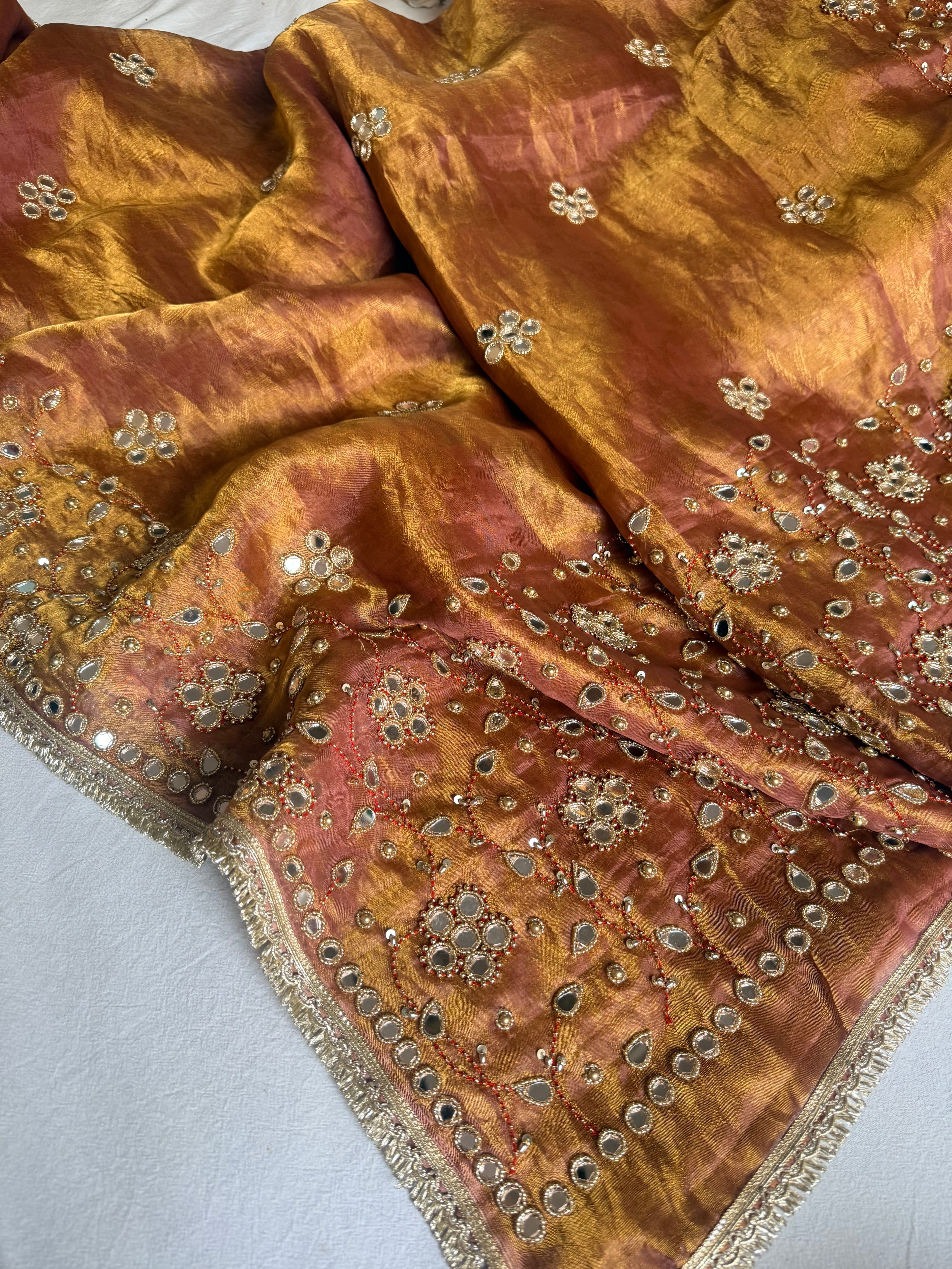 Molten pink tissue silk mirrorwork hand embroidered saree