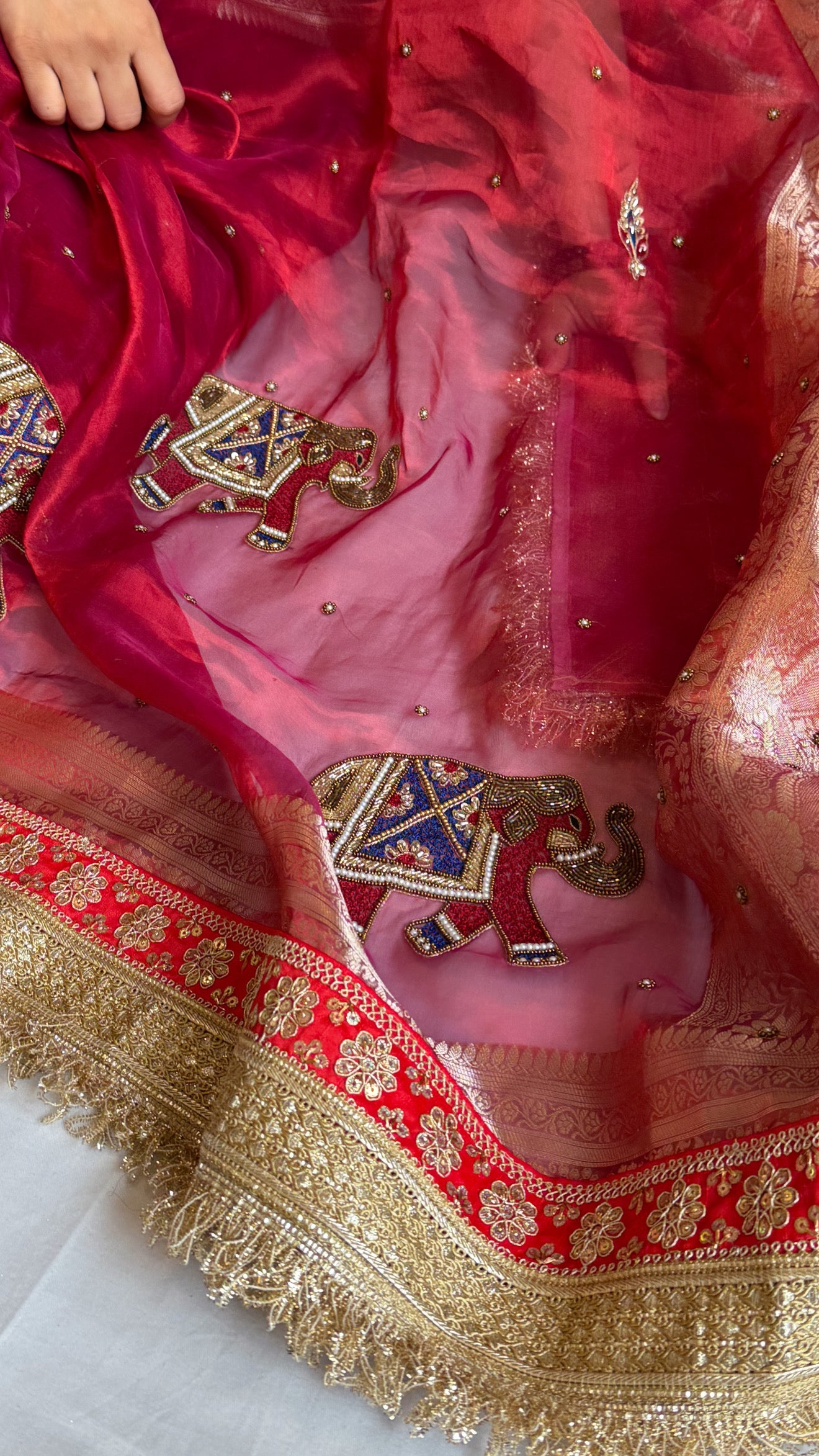 Elephant motif cranberry metallic red husn tissue silk hand embroidered saree