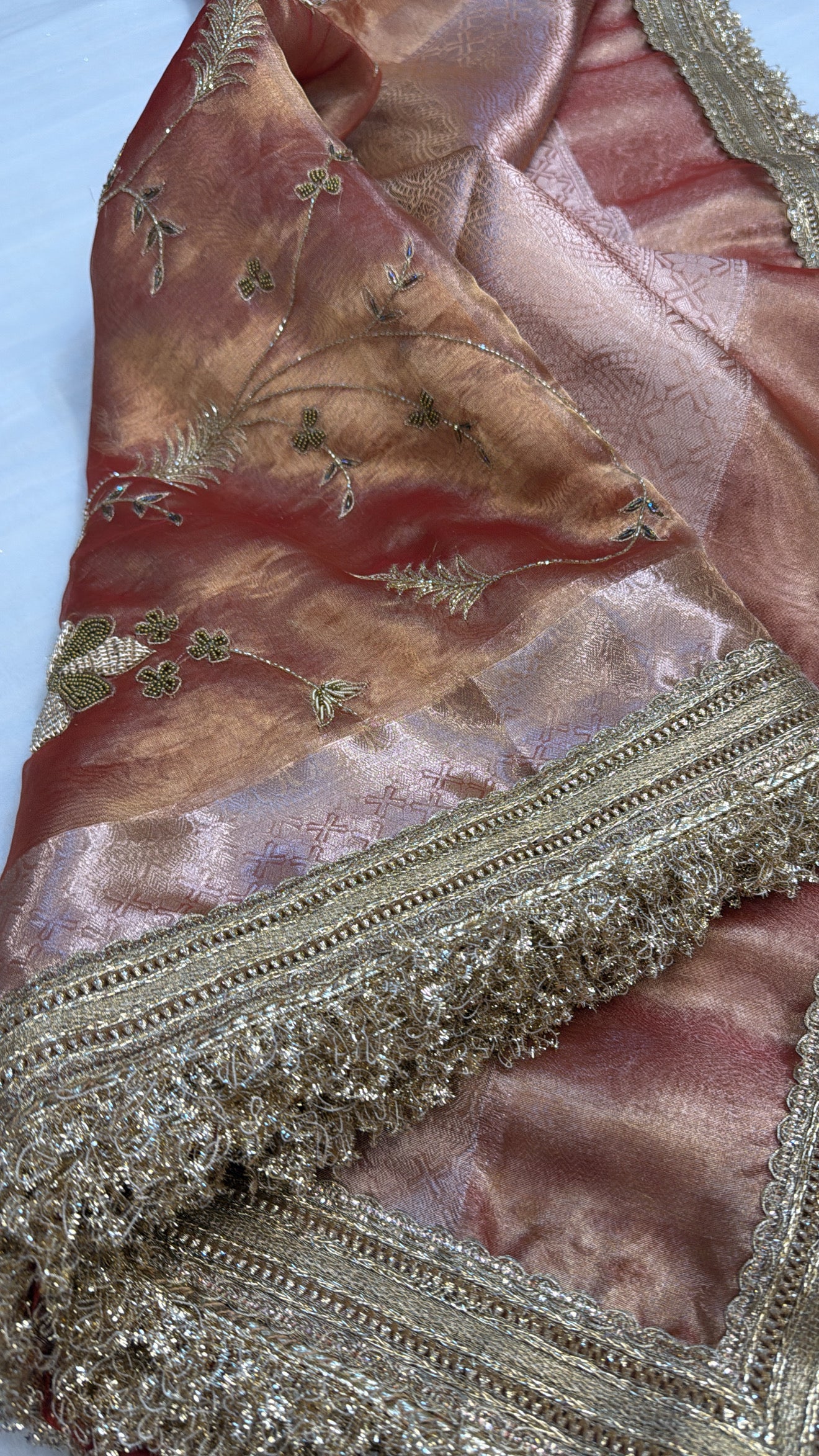 Husn tangerine red tissue silk hand embroidered saree