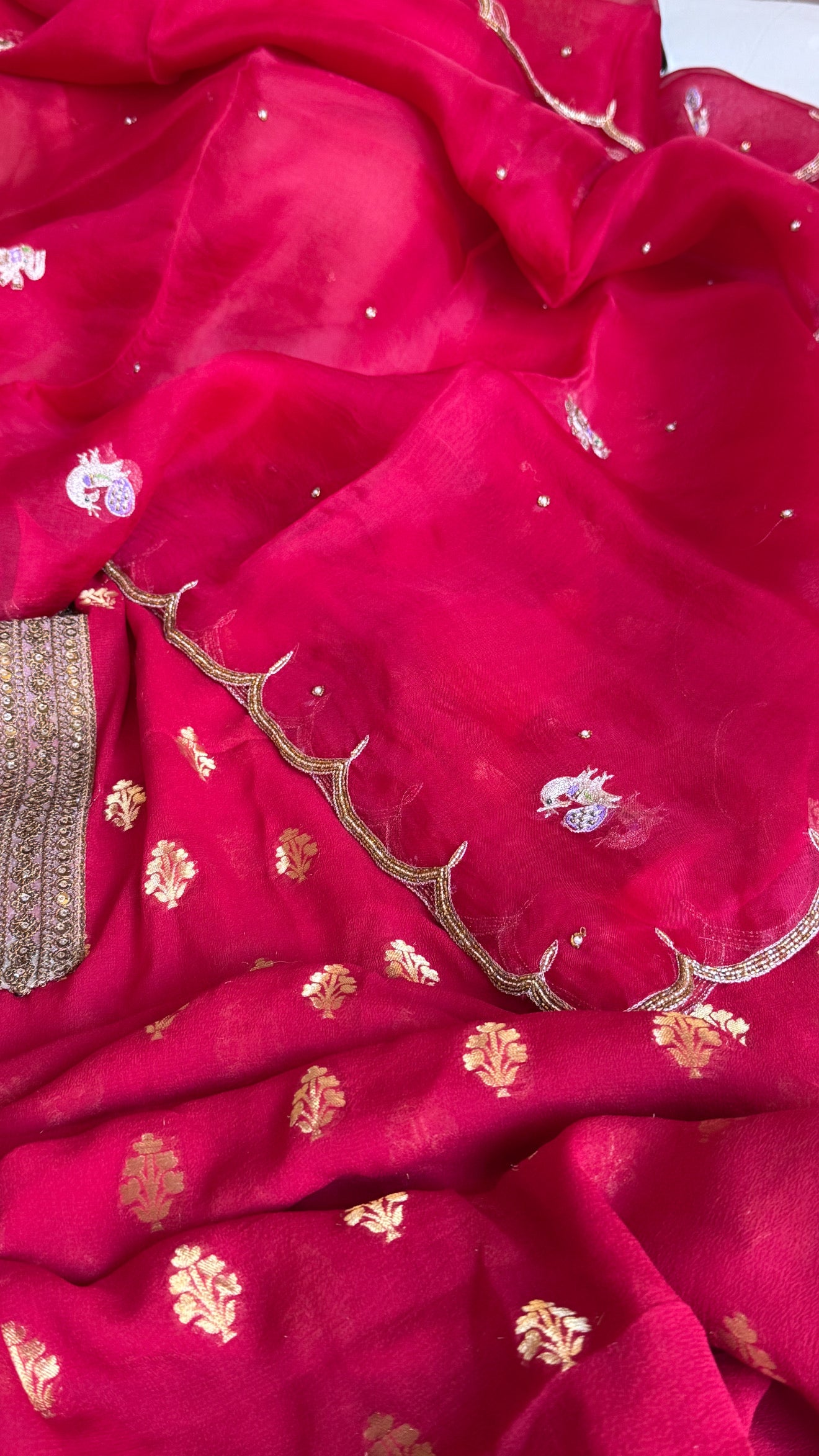 Crimson red banarasi gorgette kadhwa buti kurta paired with toy hathi motif kora silk scalloped duppata set