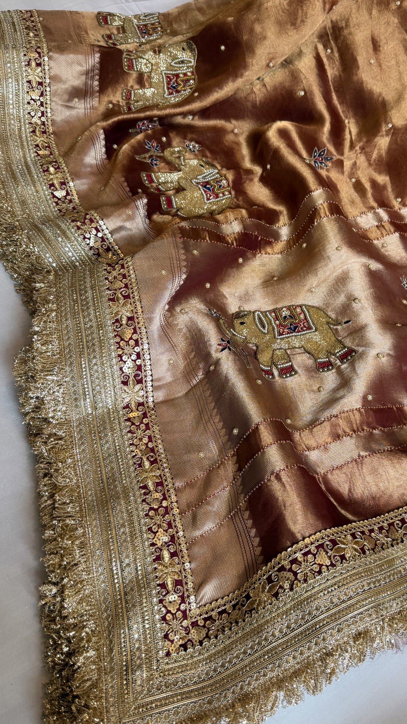 Elephant motif brown tissue silk hand embroidered husn saree