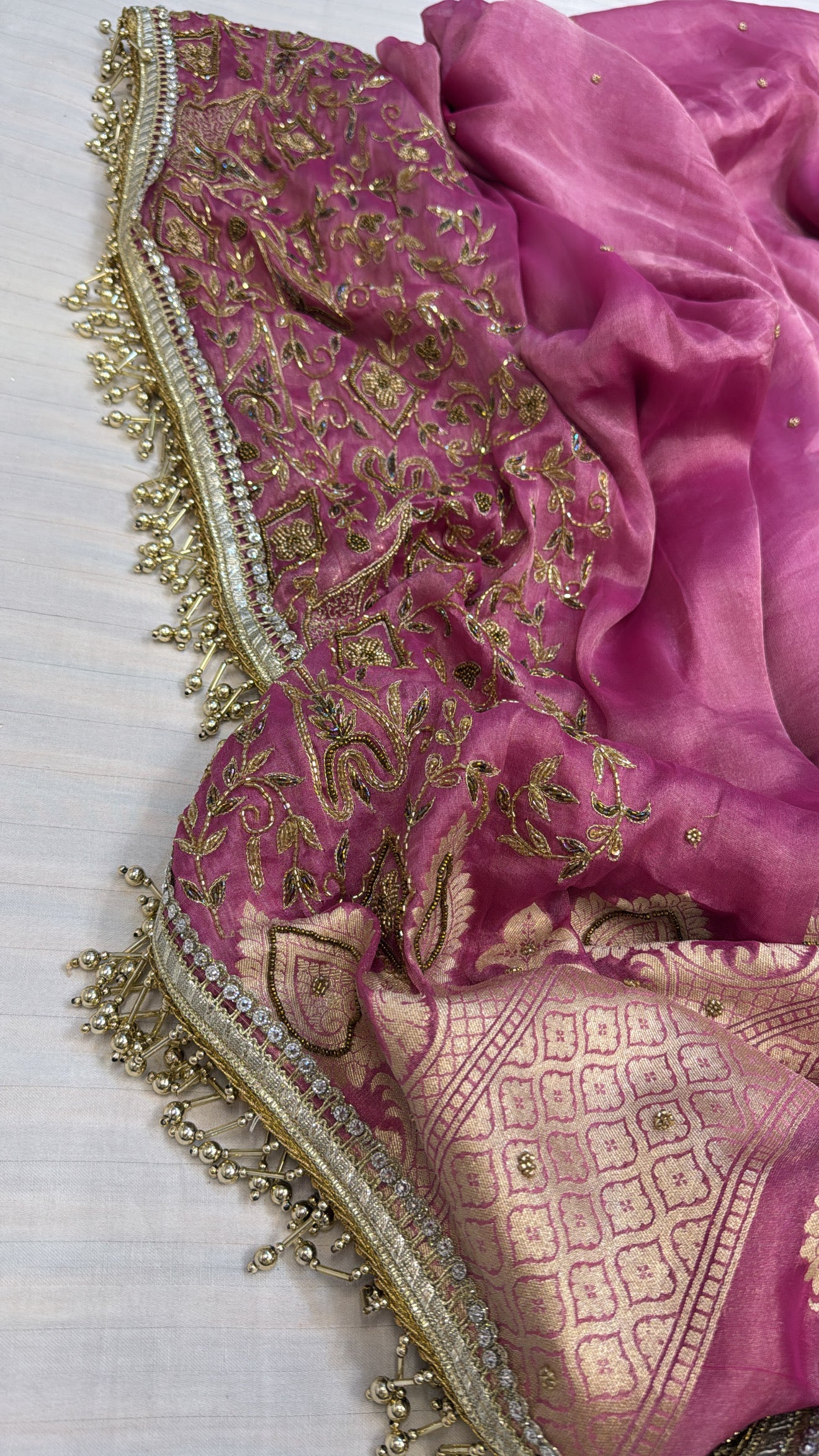 Hot pink tissue gorgette kadhwa weaving hand embroidered saree