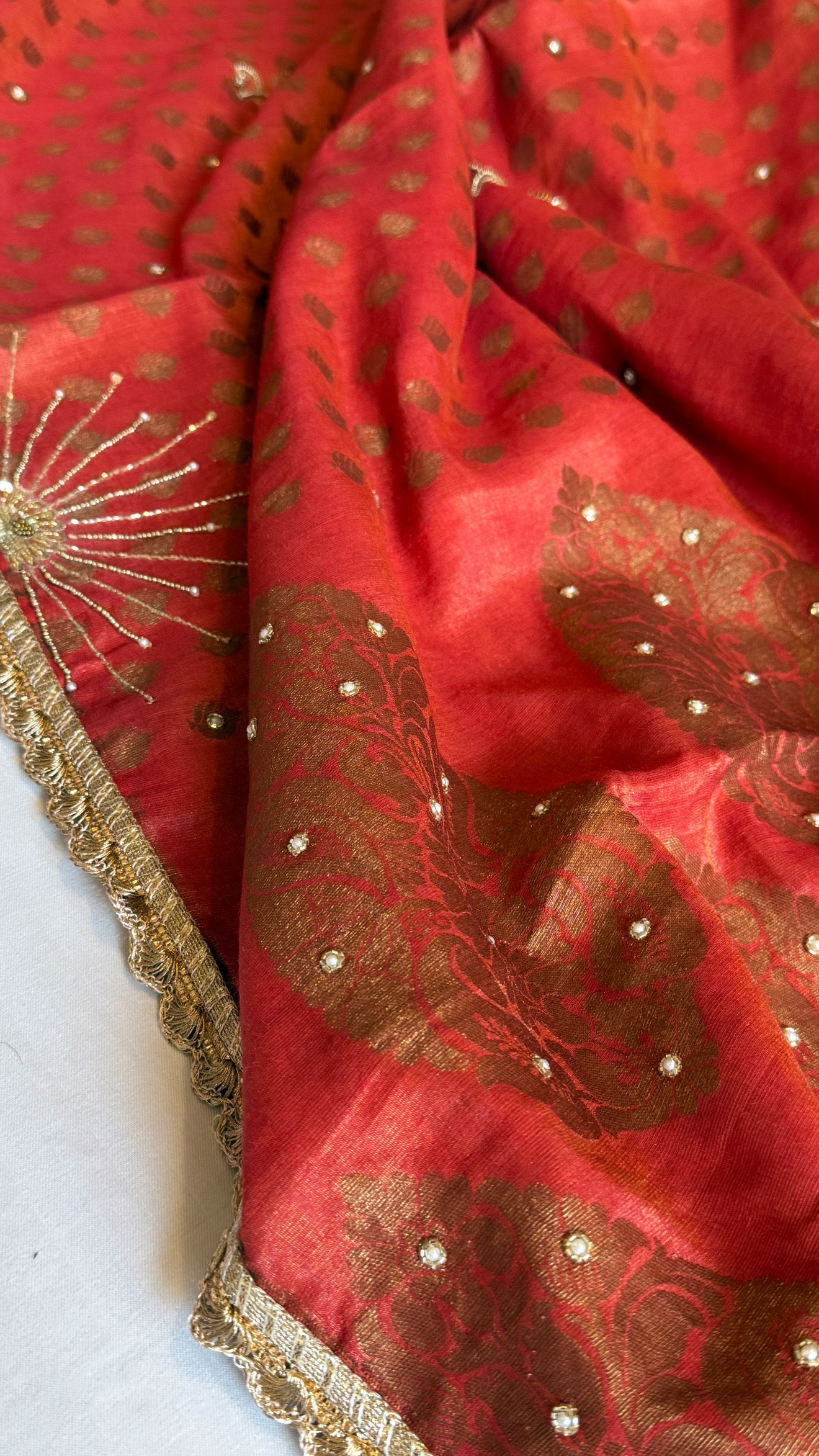 Chilly red tissue gorgette kadhwa antique zari hand embroidered saree