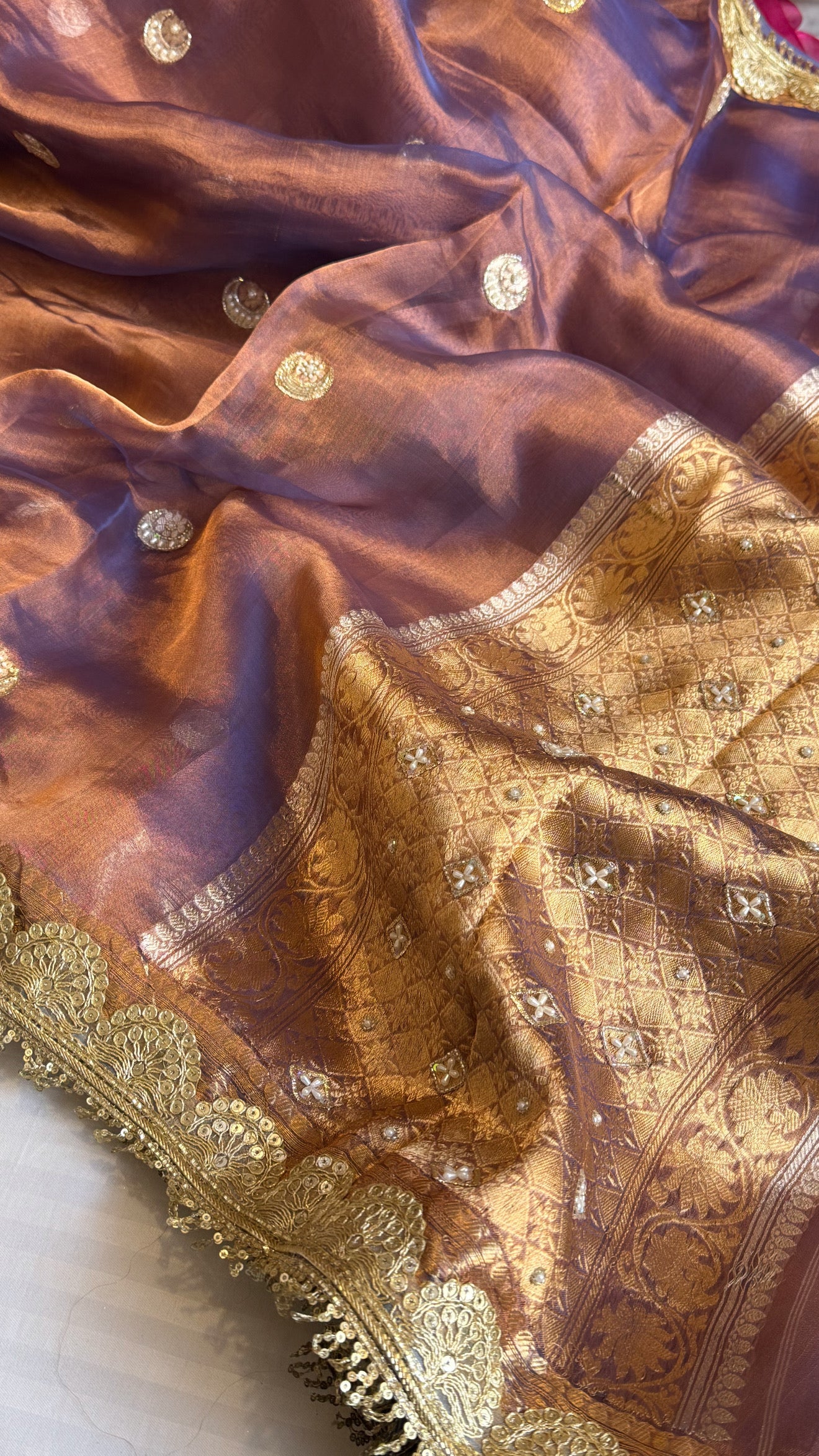 Chand tara copperish blue dhup chao effect tissue silk hand embroidered saree