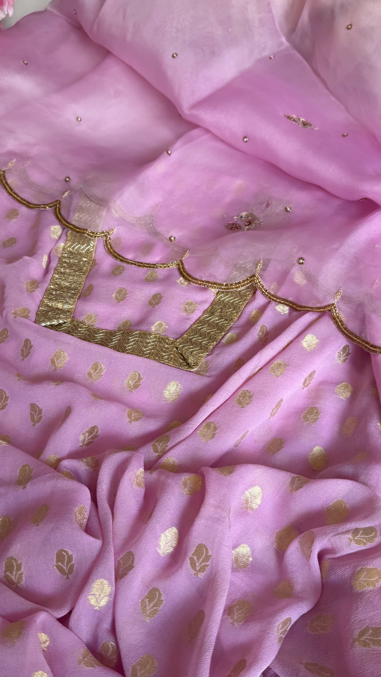 Blush pink banarasi gorgette kadhwa buti kurta paired with toy hathi motif hand embroidered scalloped kora duppata