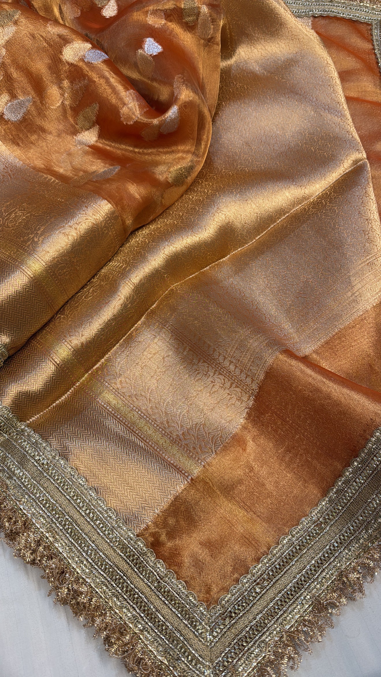 Orangey gold dhup chao effect maharani tissue silk kadhwa buti saree