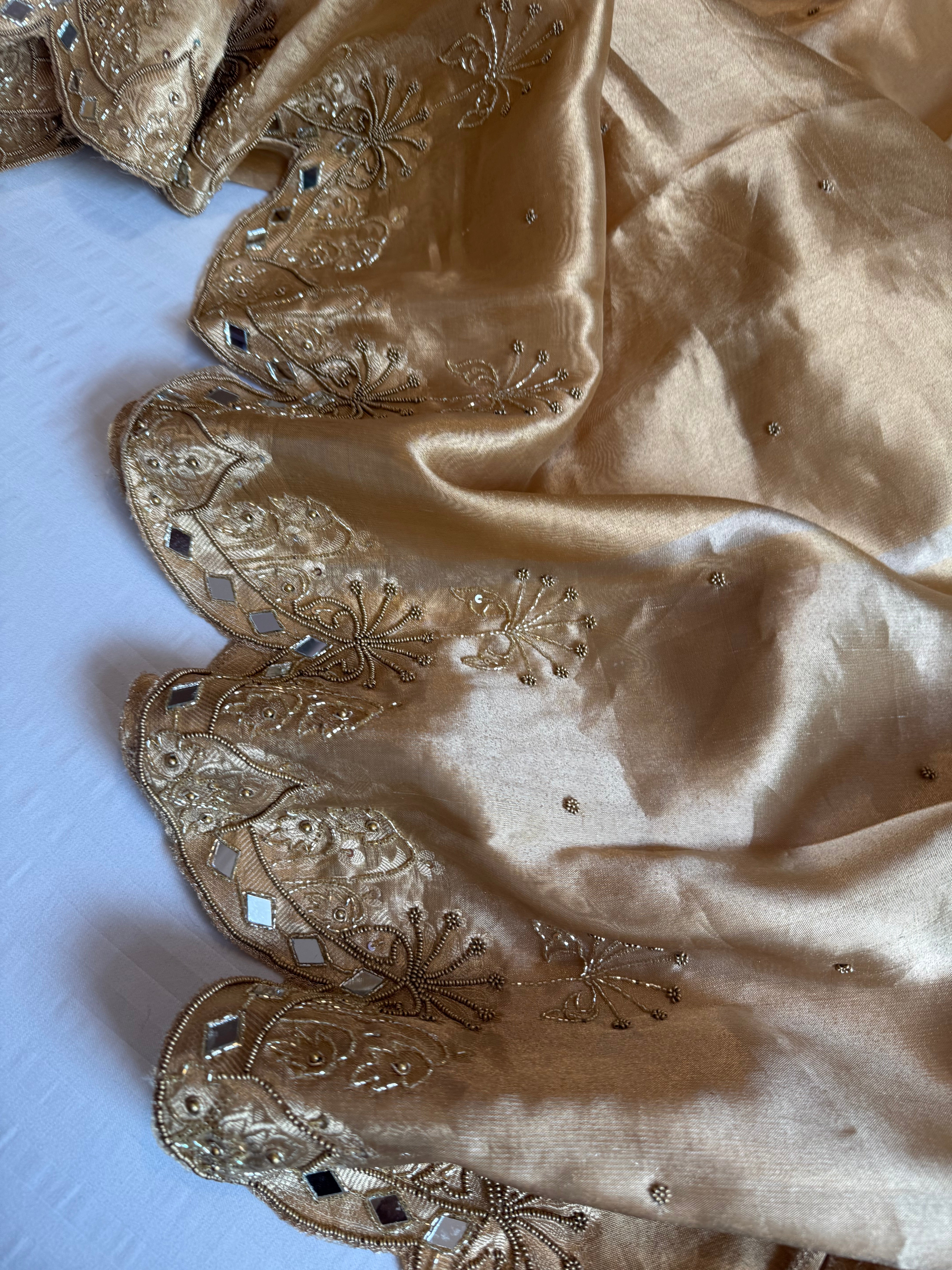 Husn champagne gold tissue silk heavy hand embroidered saree