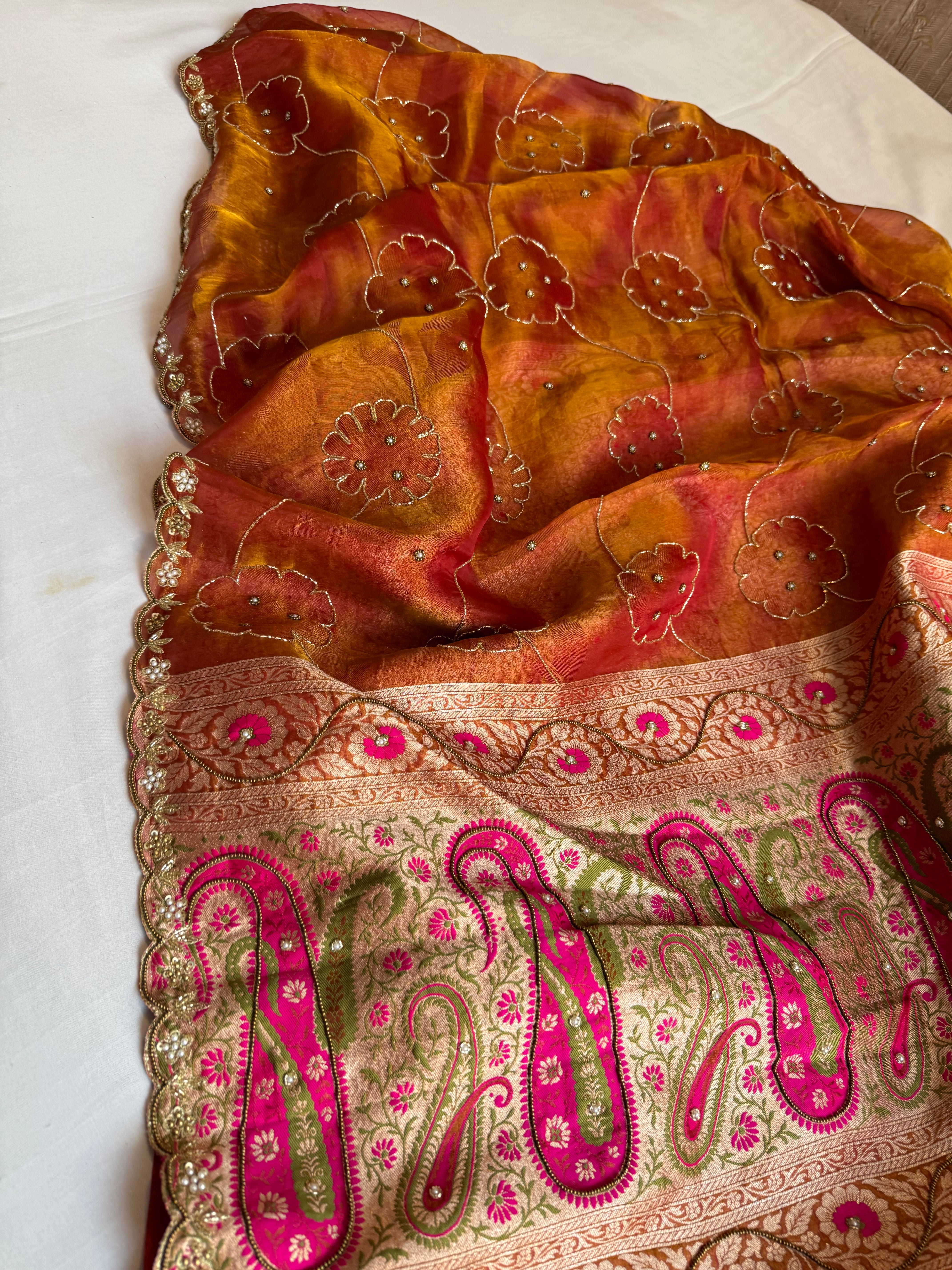 Rust orange tissue tanchoi jamevar pallu meenakari work hand embroidered saree