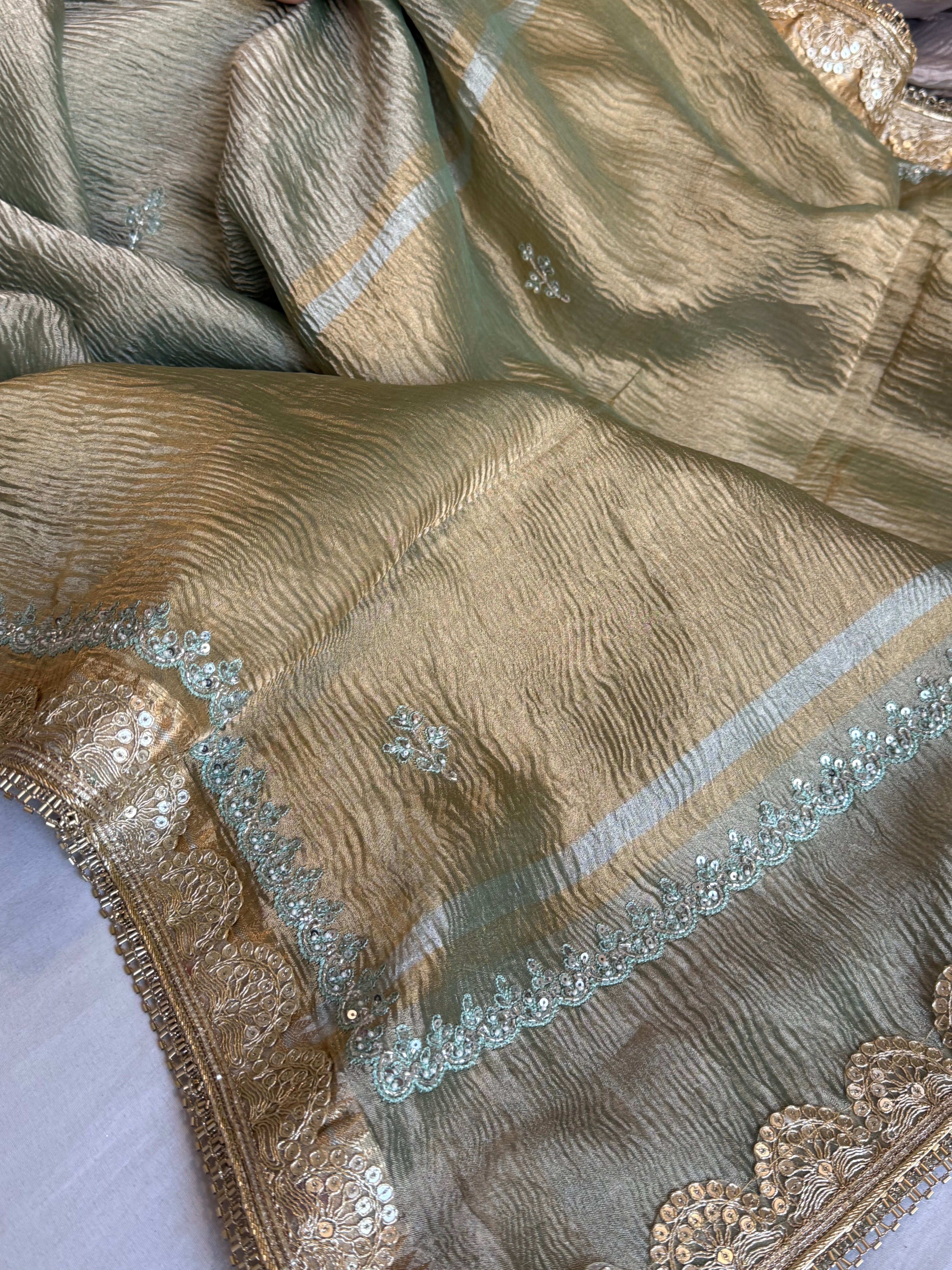 Sage green pearl work hand embroidered husn crushed tissue saree