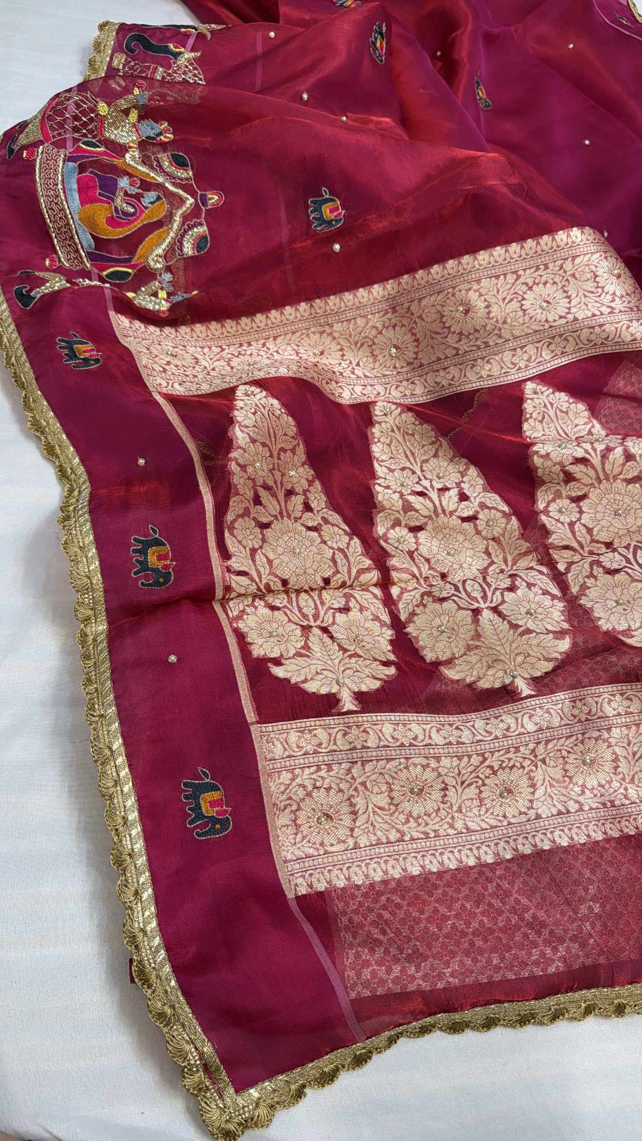Husn metallic cherry red tissue silk hand embroidered saree