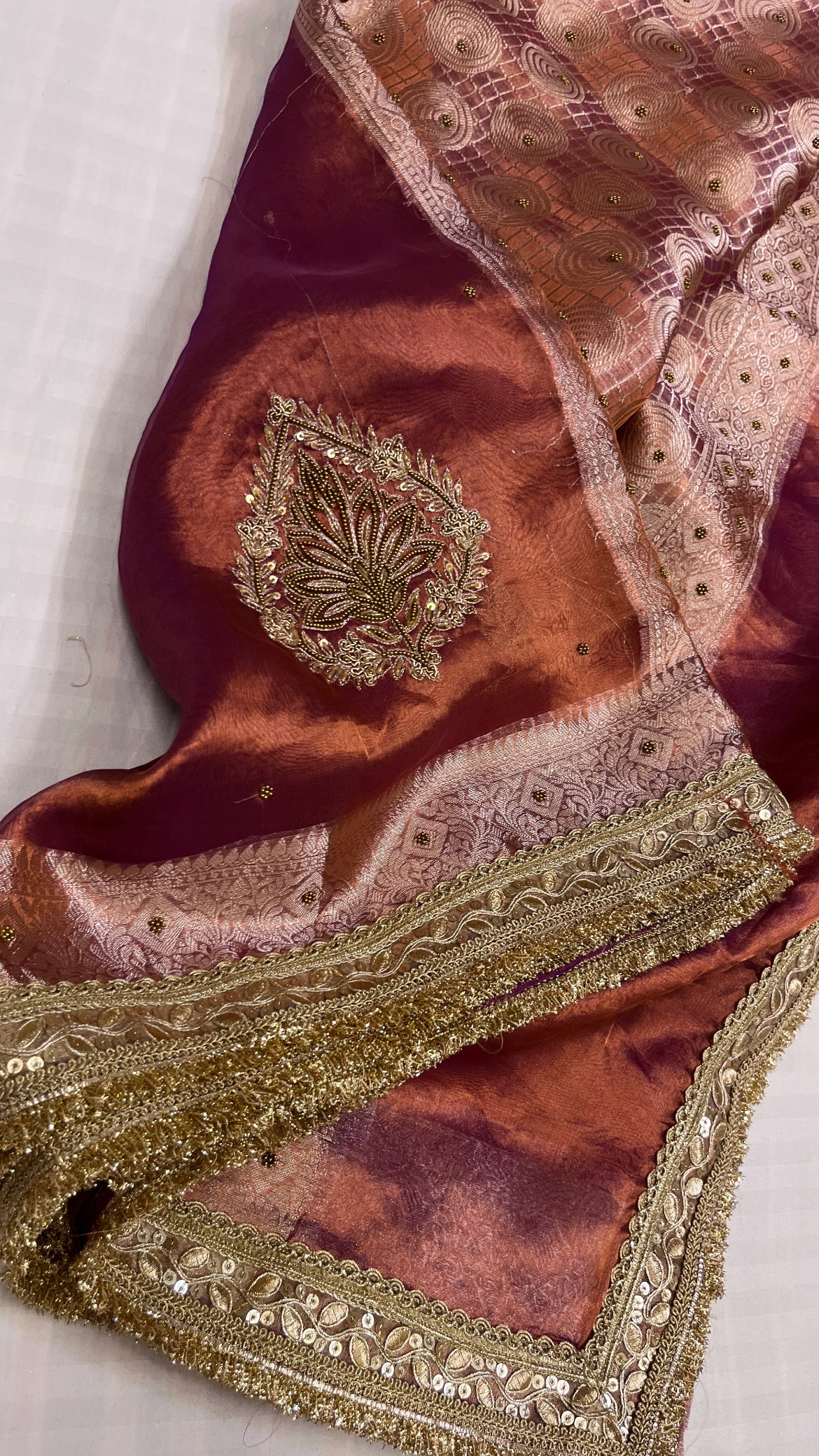 Husn copperish purple tissue silk hand embroidered saree