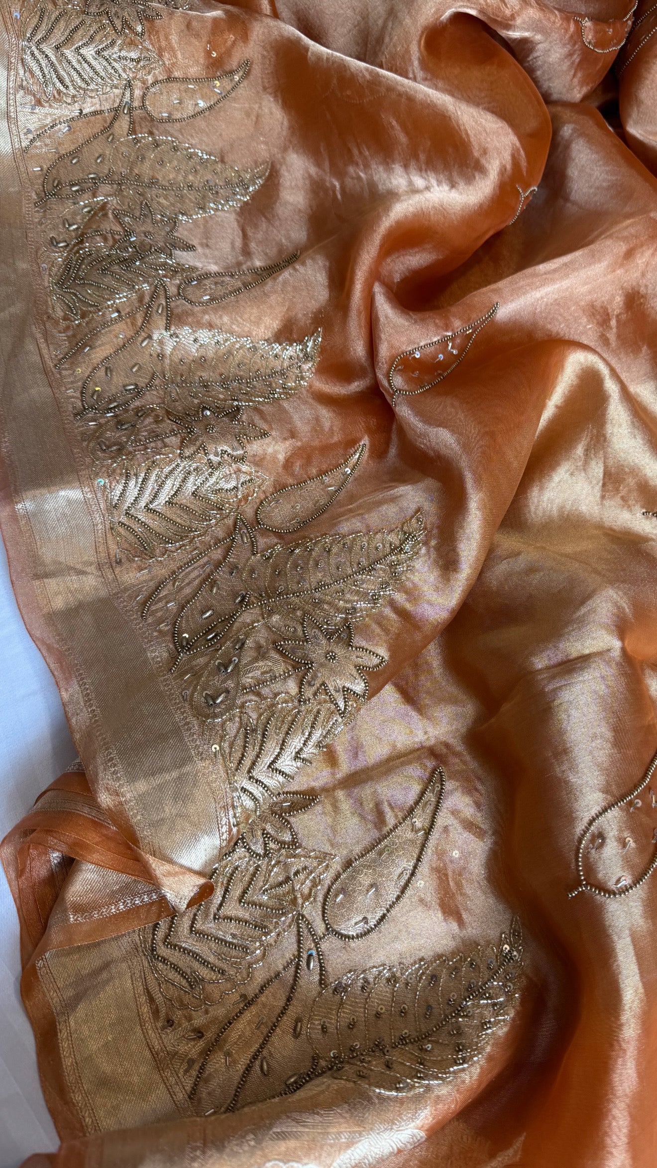 Husn tangerine red tissue silk heavy hand embroidered saree