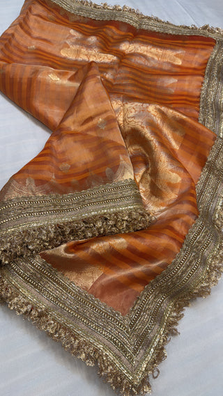 Maharani chuski fanta orange tissue silk striped saree