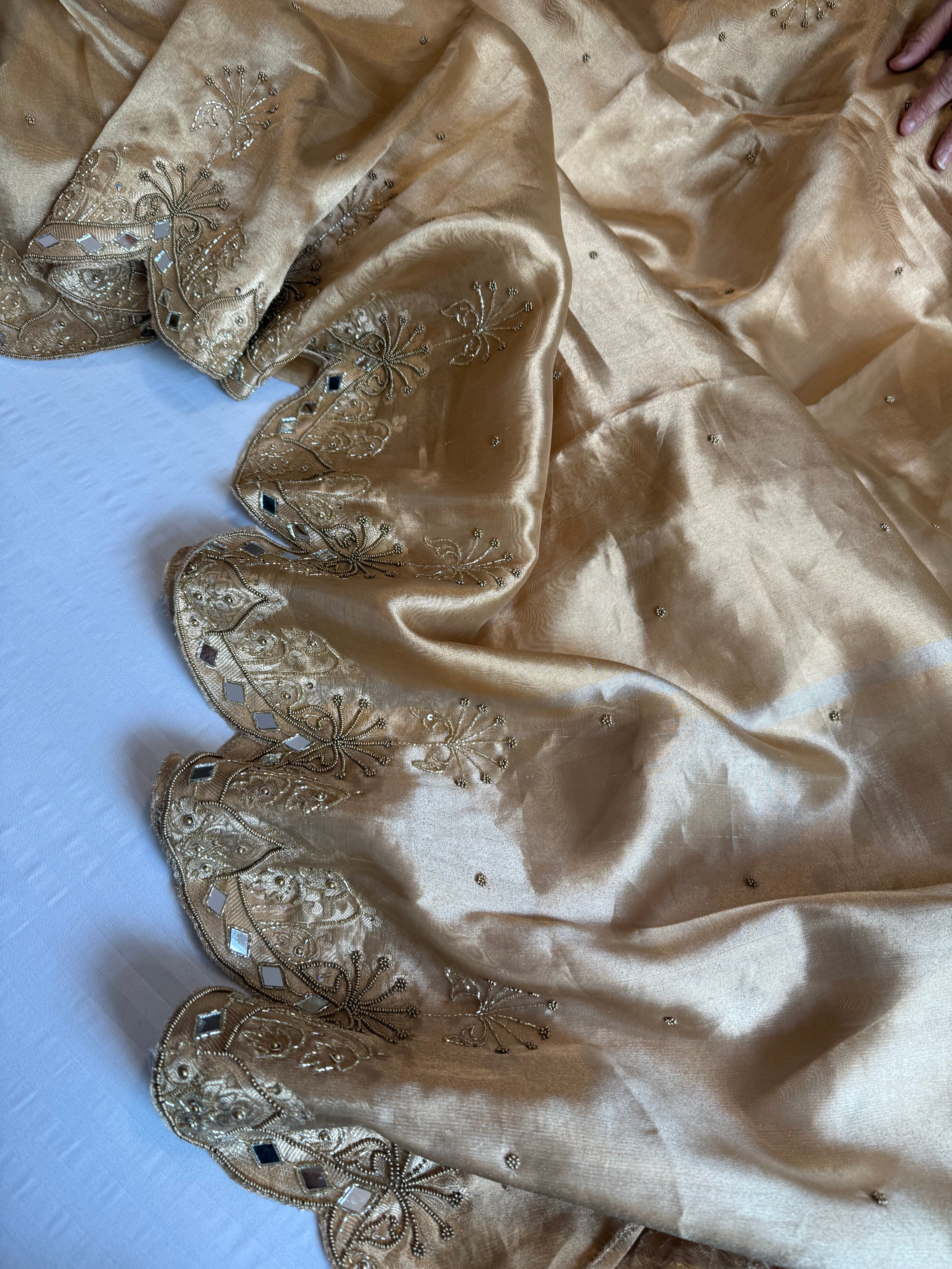 Husn champagne gold tissue silk heavy hand embroidered saree