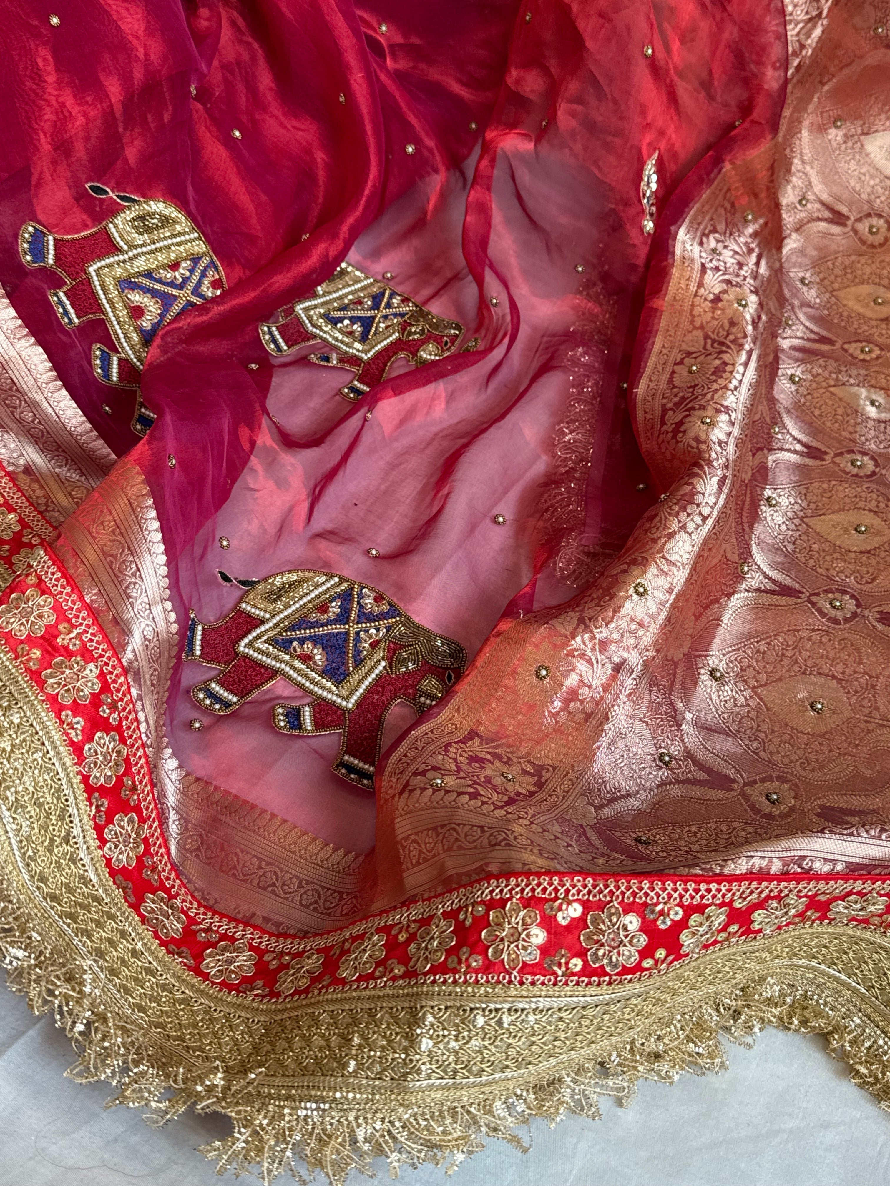 Elephant motif cranberry metallic red husn tissue silk hand embroidered saree