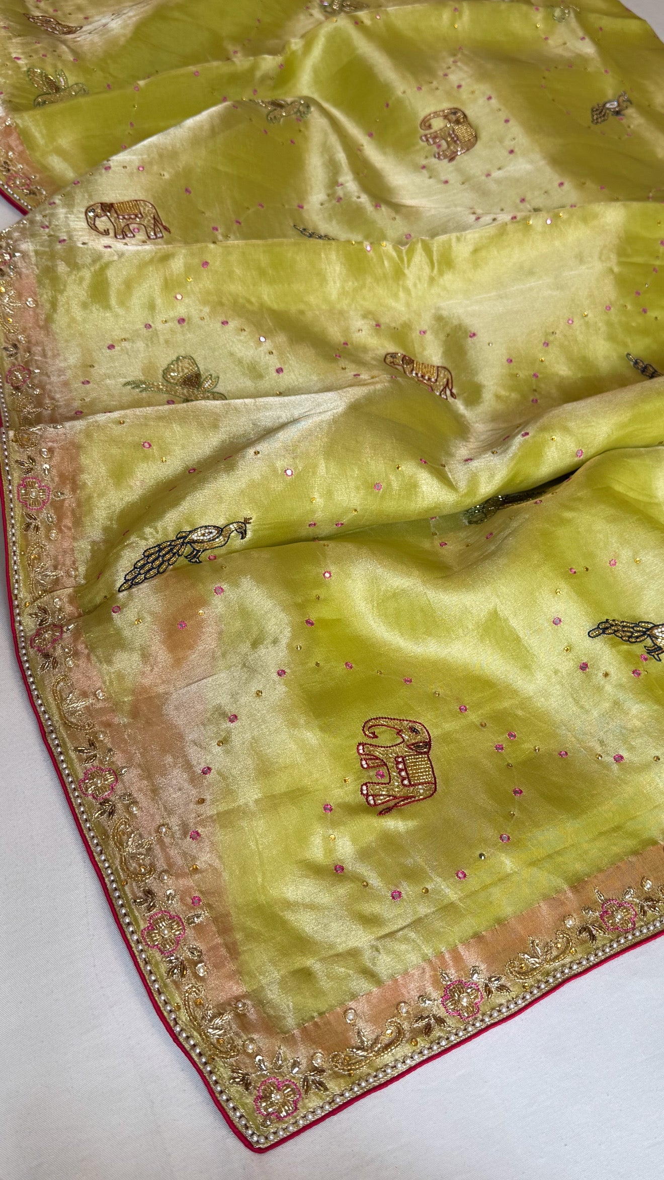 Lime yellow shikarbagh edit tissue silk kadhwa hand embroidered saree