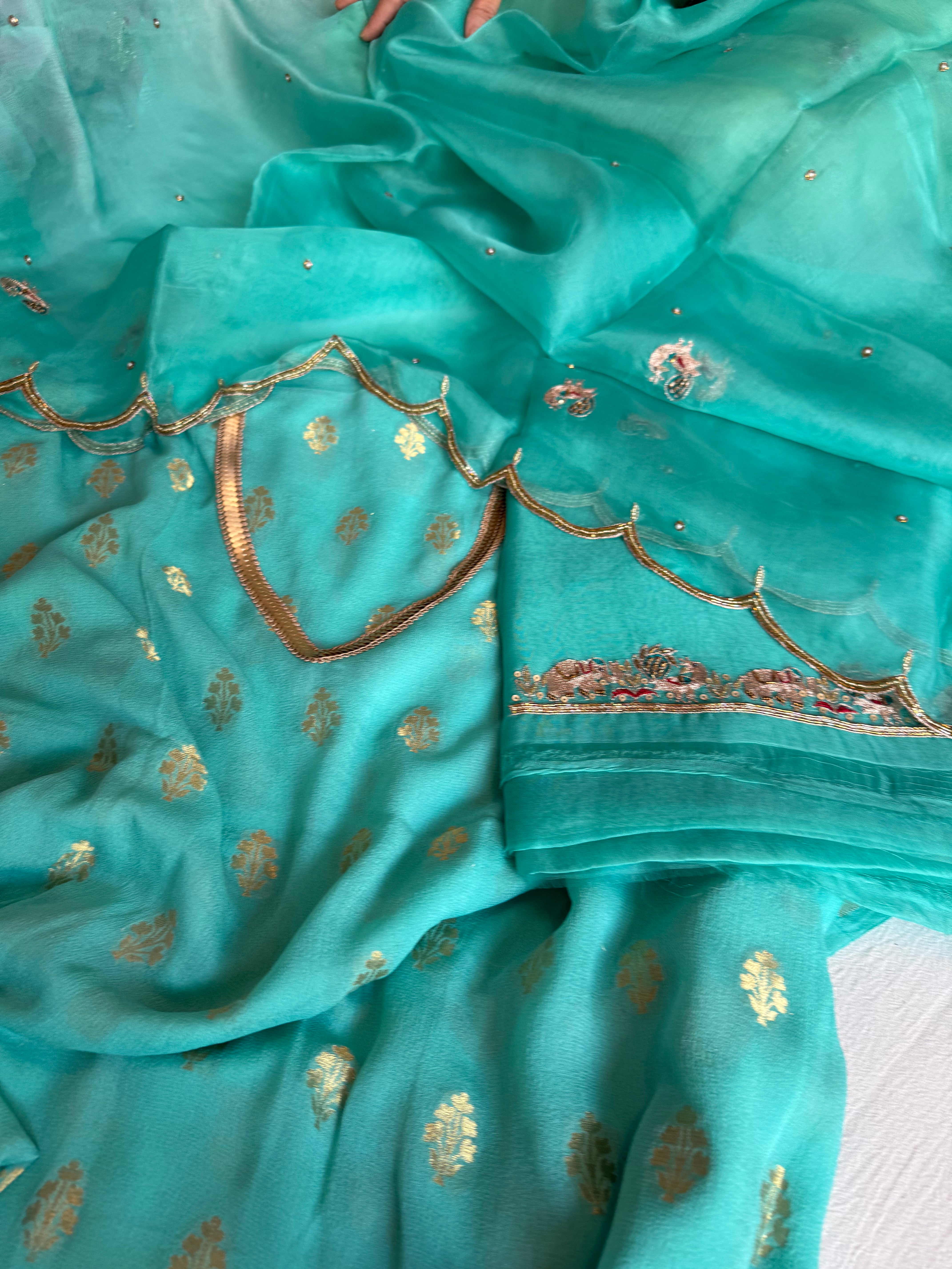 Rama blue banarasi gorgette kadhwa buti kurta paired with toy hathi motif hand embroidered scalloped duppata