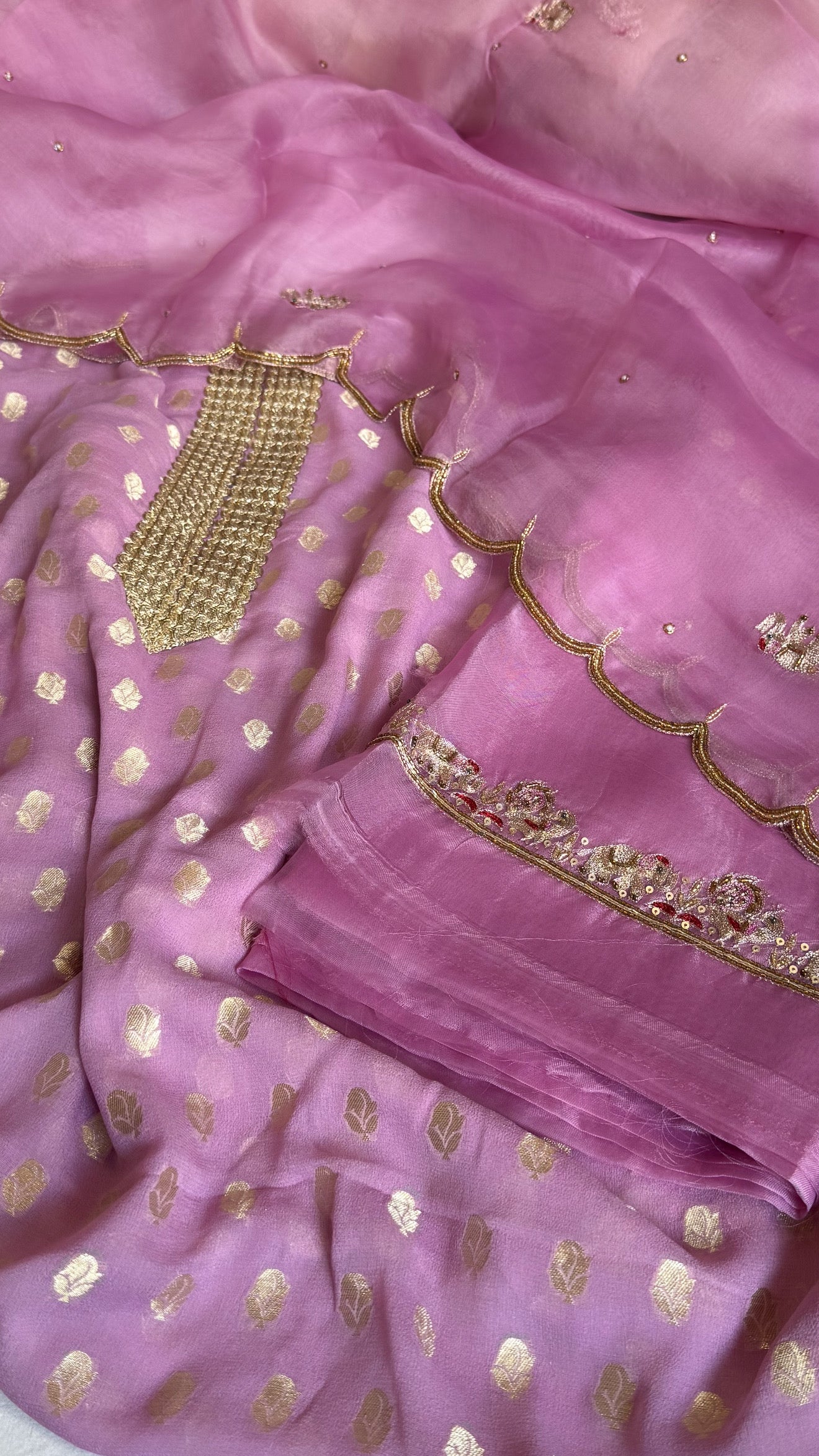 Dusty pink banarasi gorgette kadhwa buti kurta paired with toy hathi motif hand embroidered scalloped kora duppata