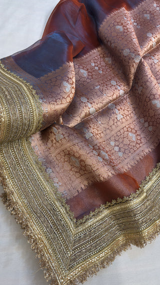 Maharani metallic maroonish-blue dhup chao effect tissue silk saree
