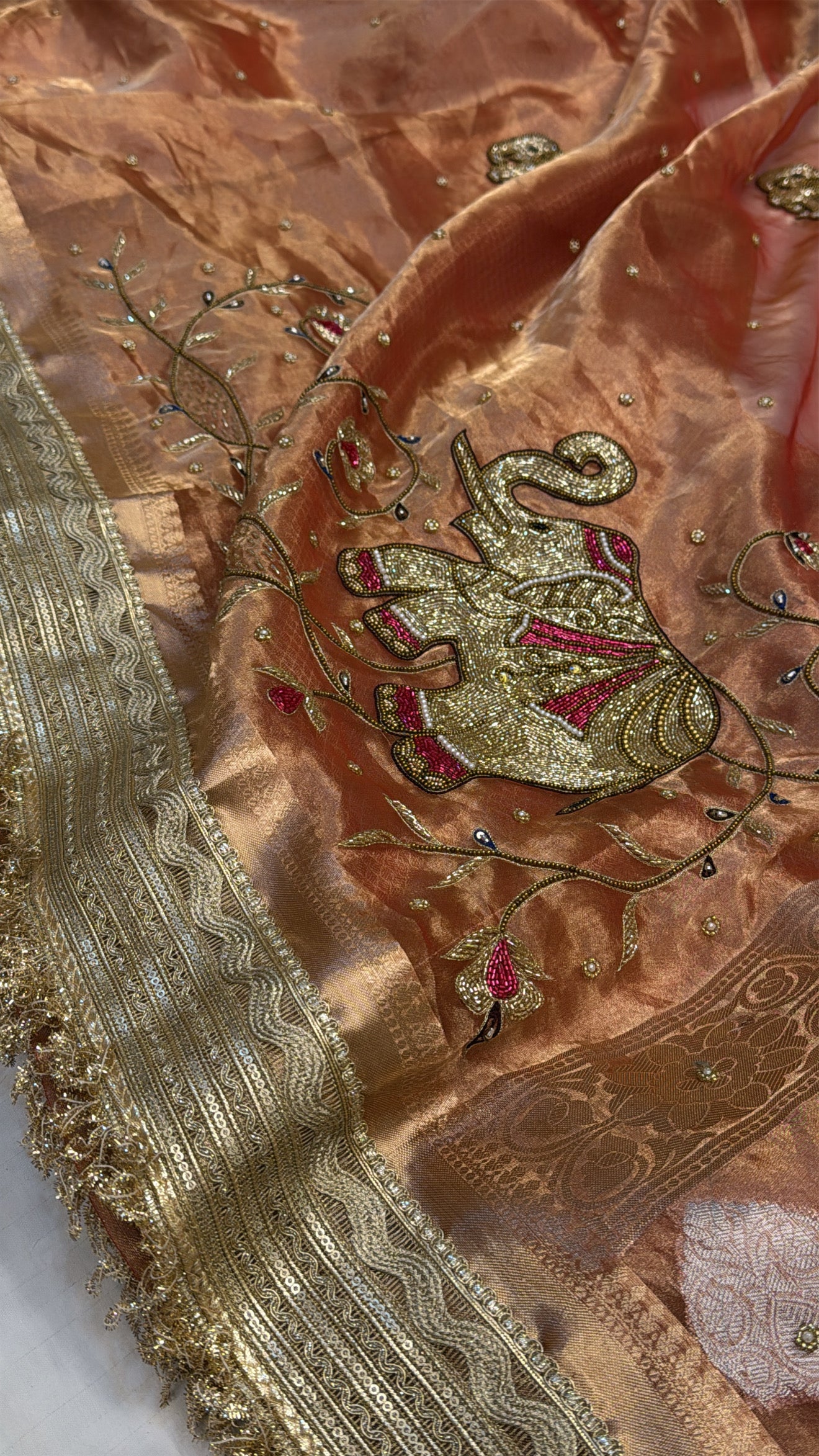 Narangi shade tissue silk dhup chao effect husn hand embroidered kadhwa saree