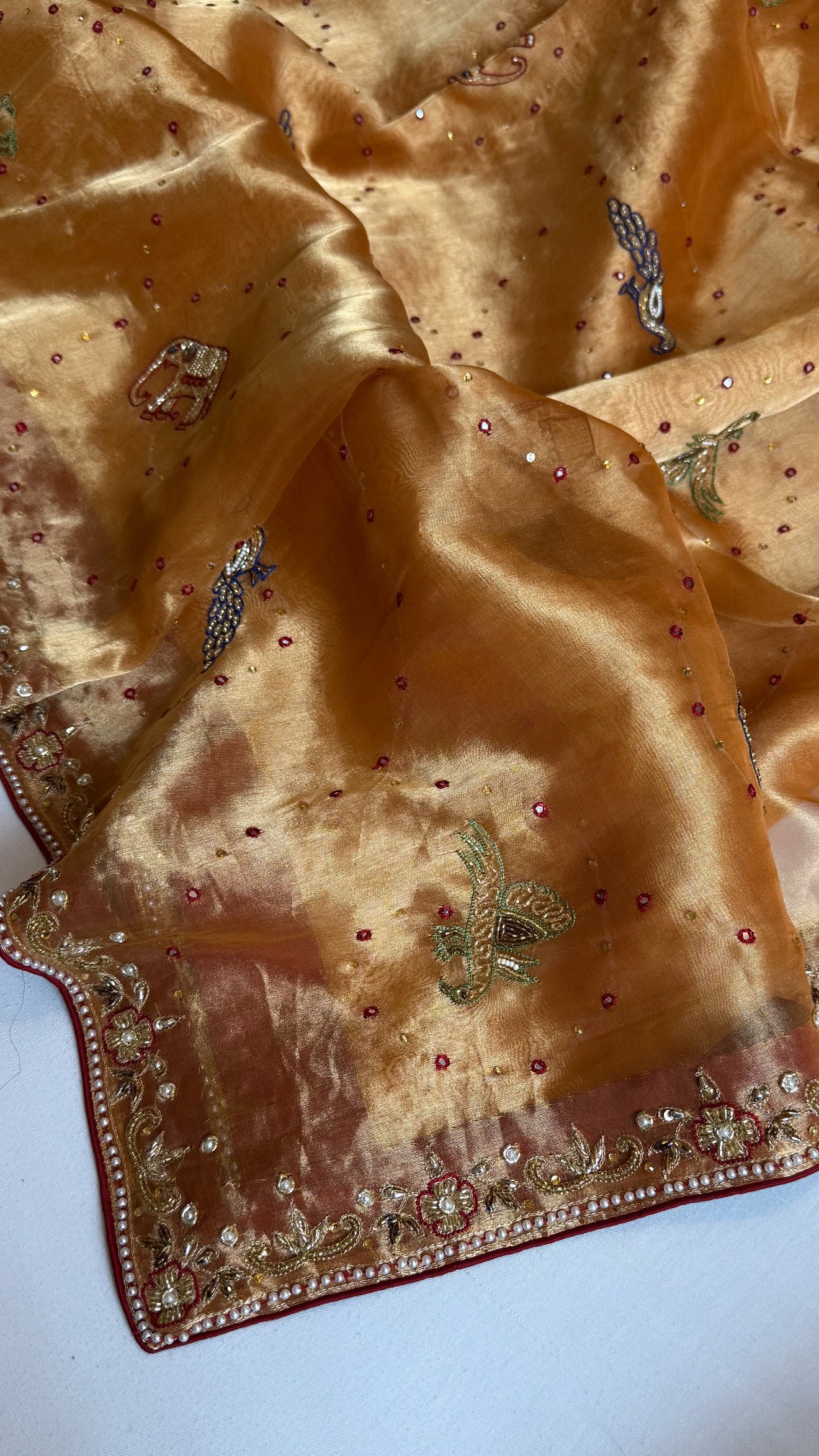 Shikarbagh edit spicy tangerine orange diamond tissue silk hand embroidered kadhwa saree