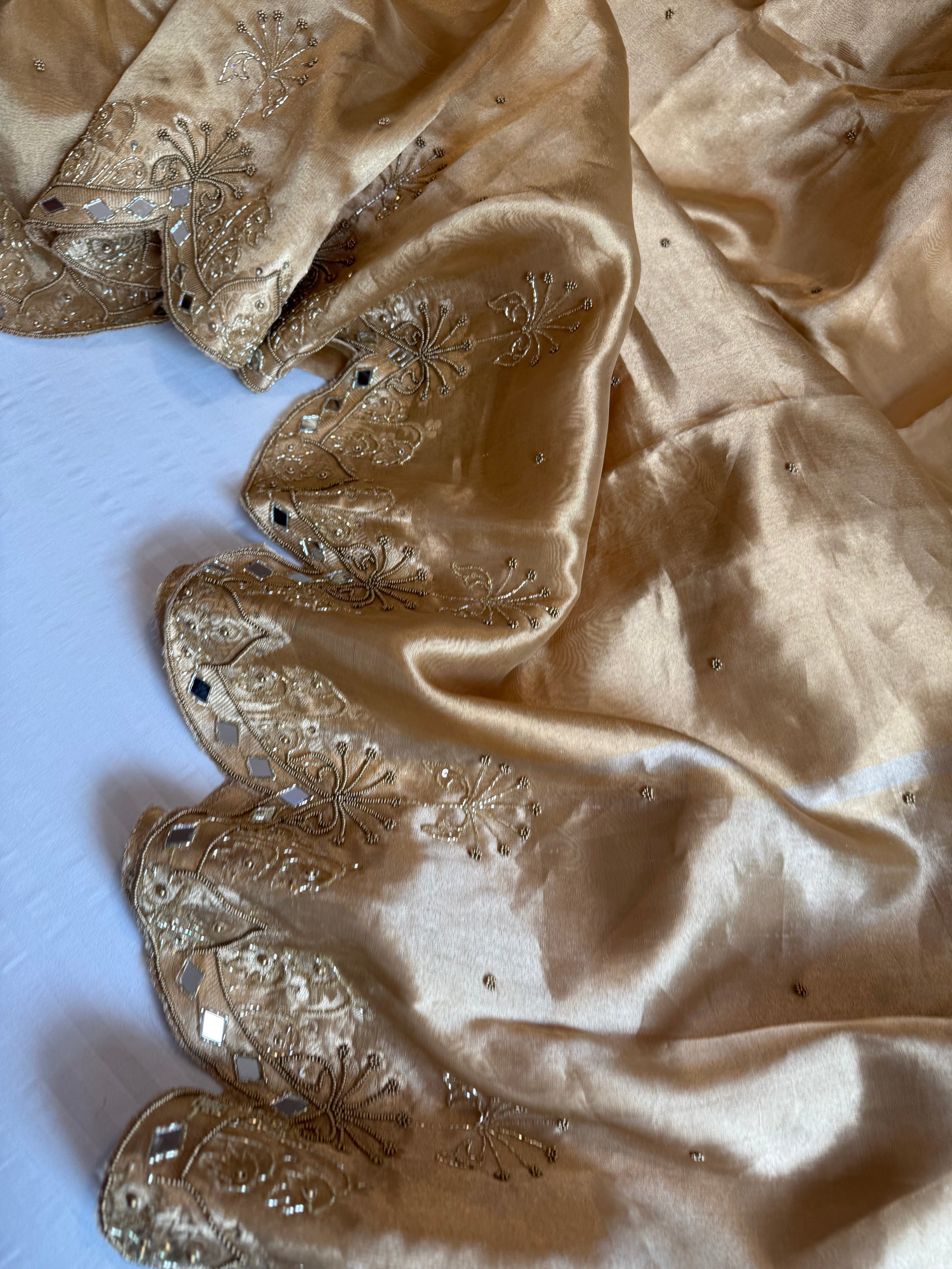 Husn champagne gold tissue silk heavy hand embroidered saree