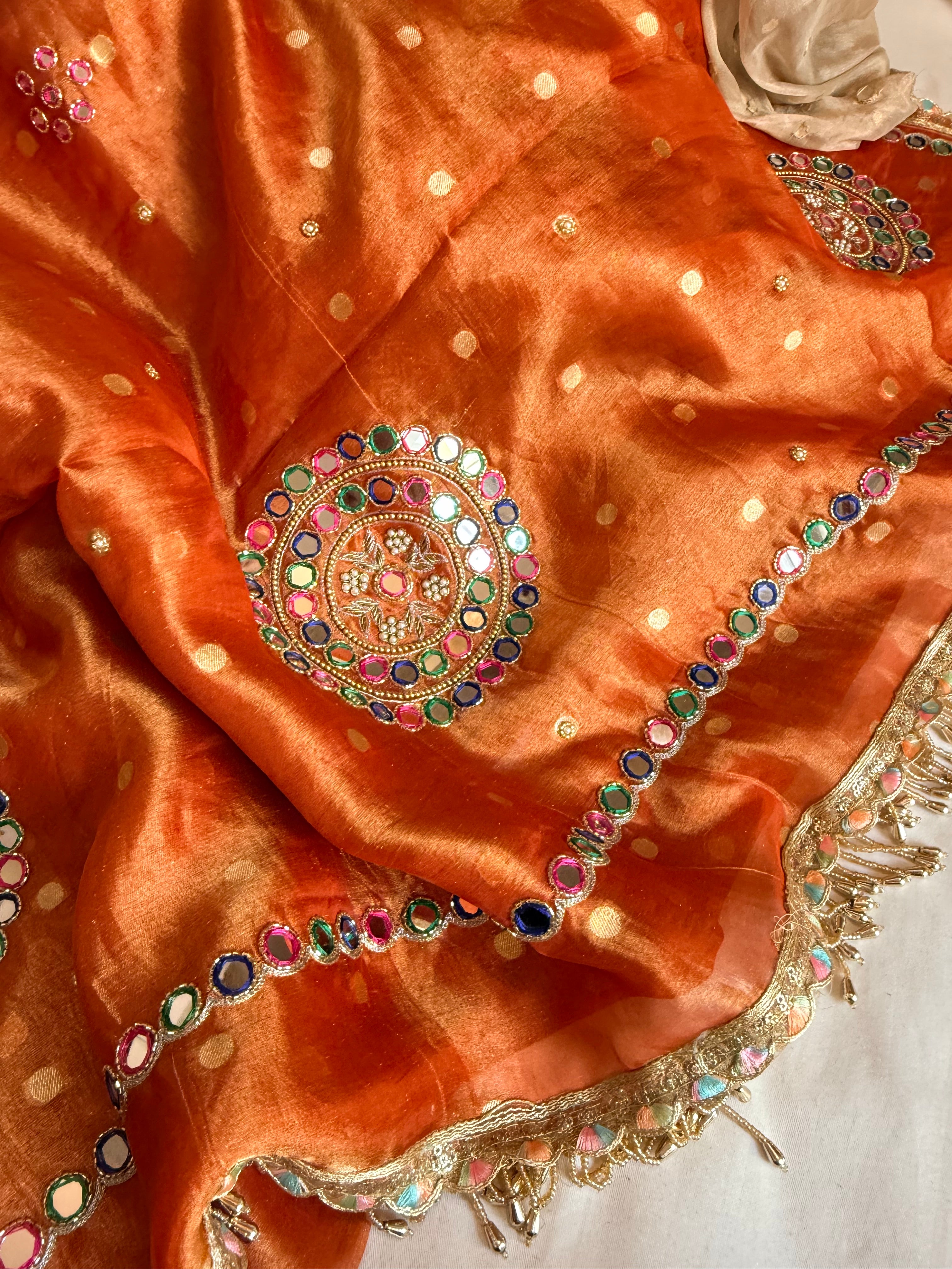 Fanta orange tissue silk meenakari mirror work hand embroidered saree
