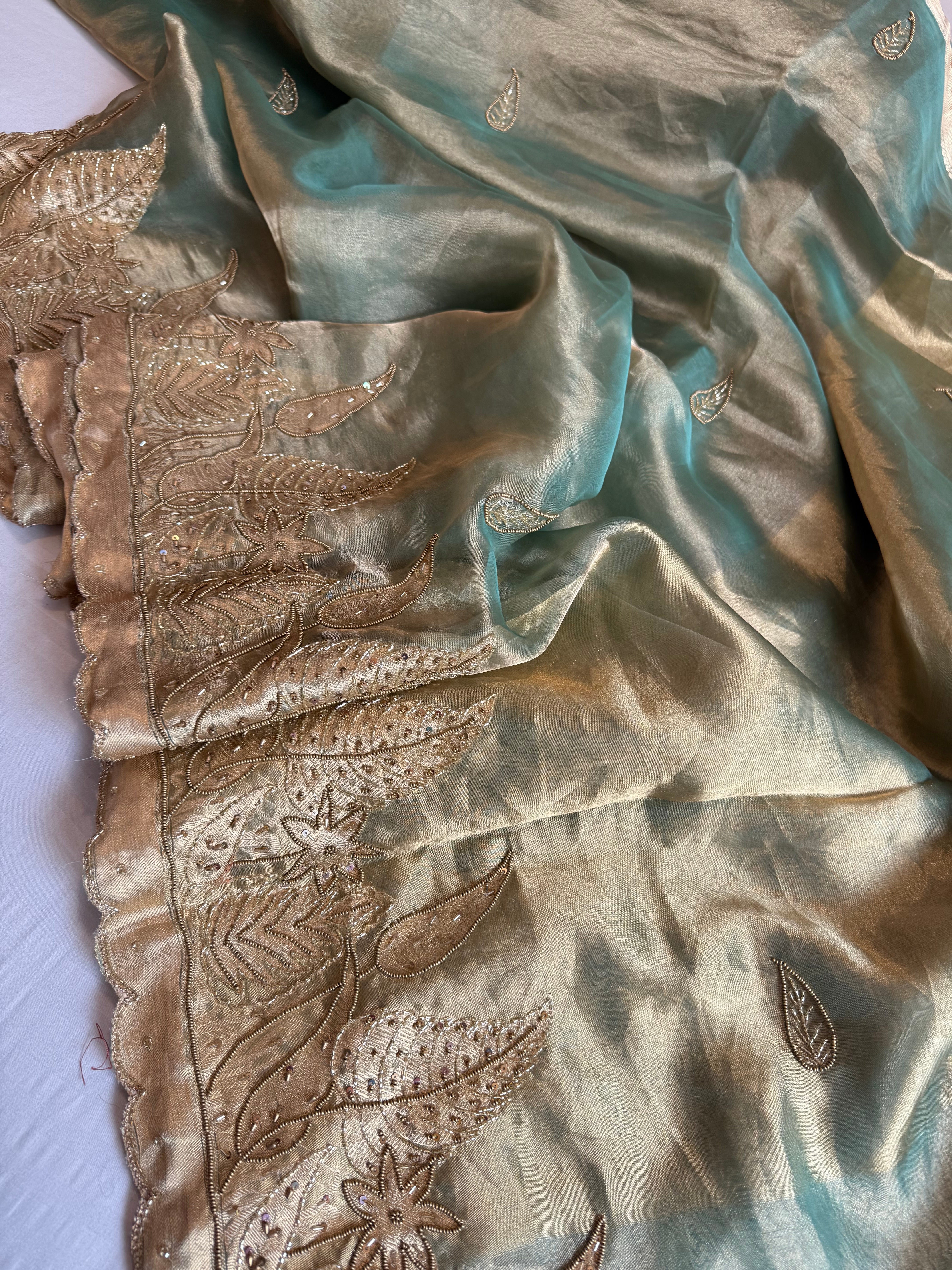 Husn candy green tissue silk heavy hand embroidered saree