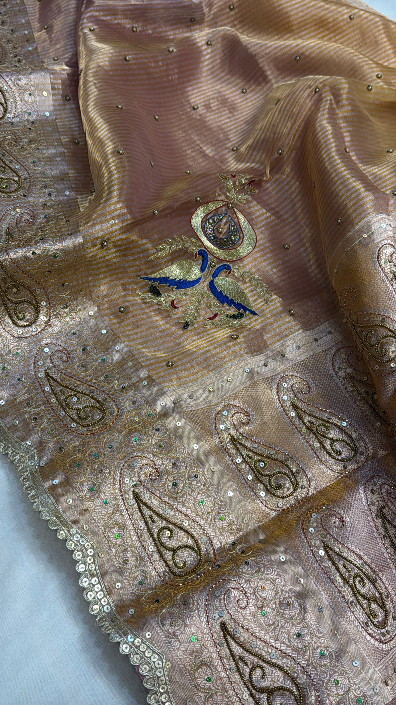 Peachish-pink ombre shaded tissue silk hand embroidered saree