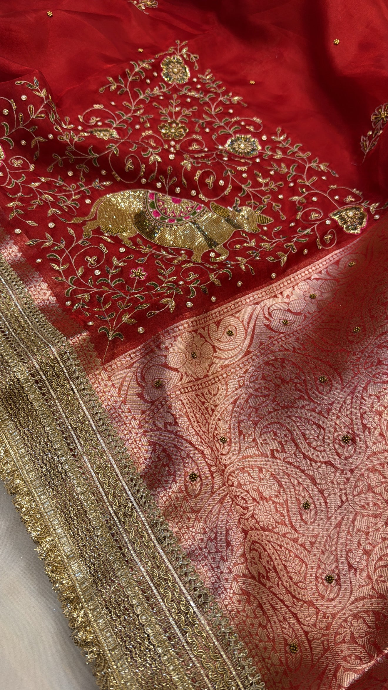 Blood red tissue silk nandi motif zardozi work hand embroidered saree