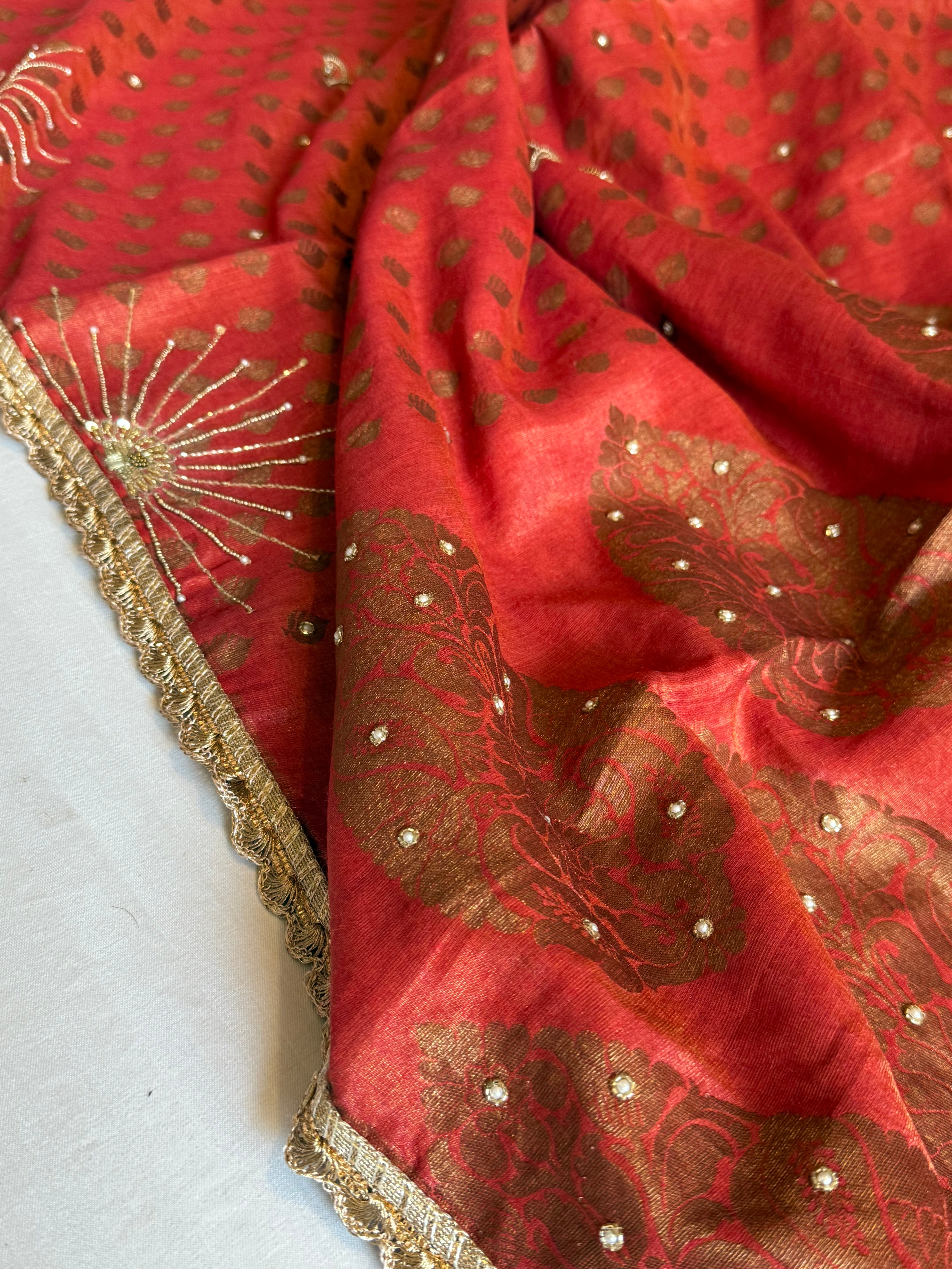 Chilly red tissue gorgette kadhwa antique zari hand embroidered saree