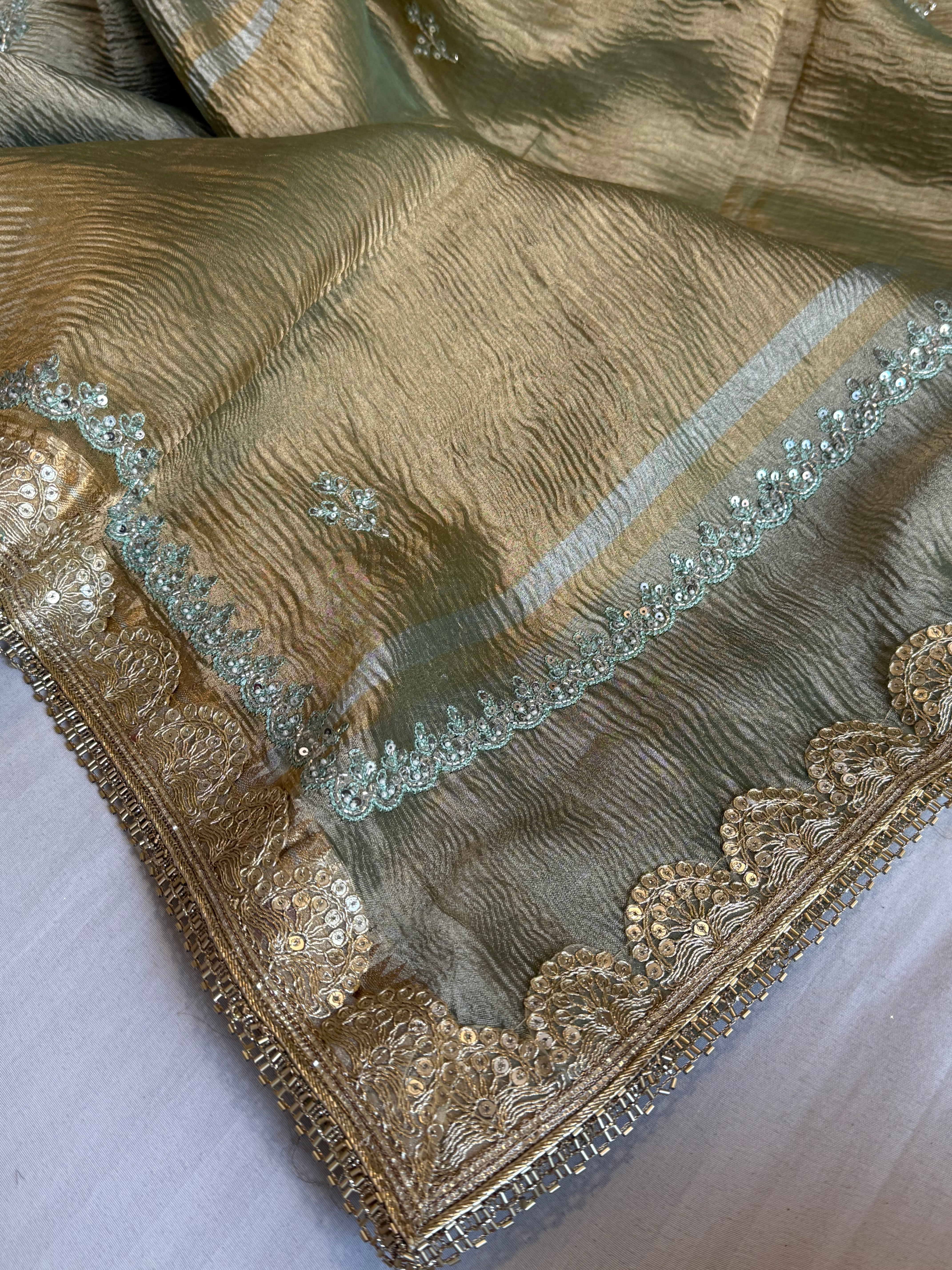 Sage green pearl work hand embroidered husn crushed tissue saree