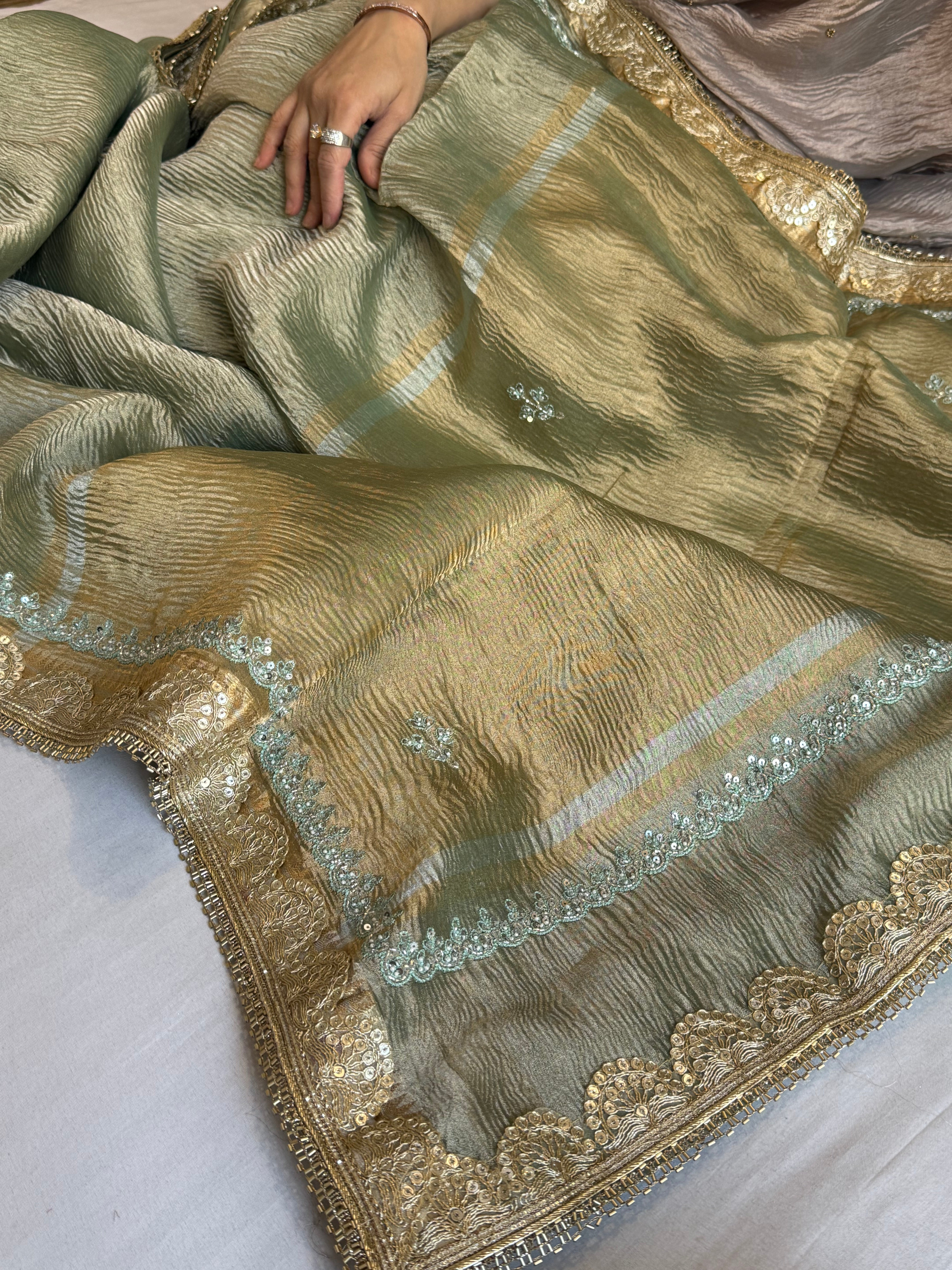 Sage green pearl work hand embroidered husn crushed tissue saree