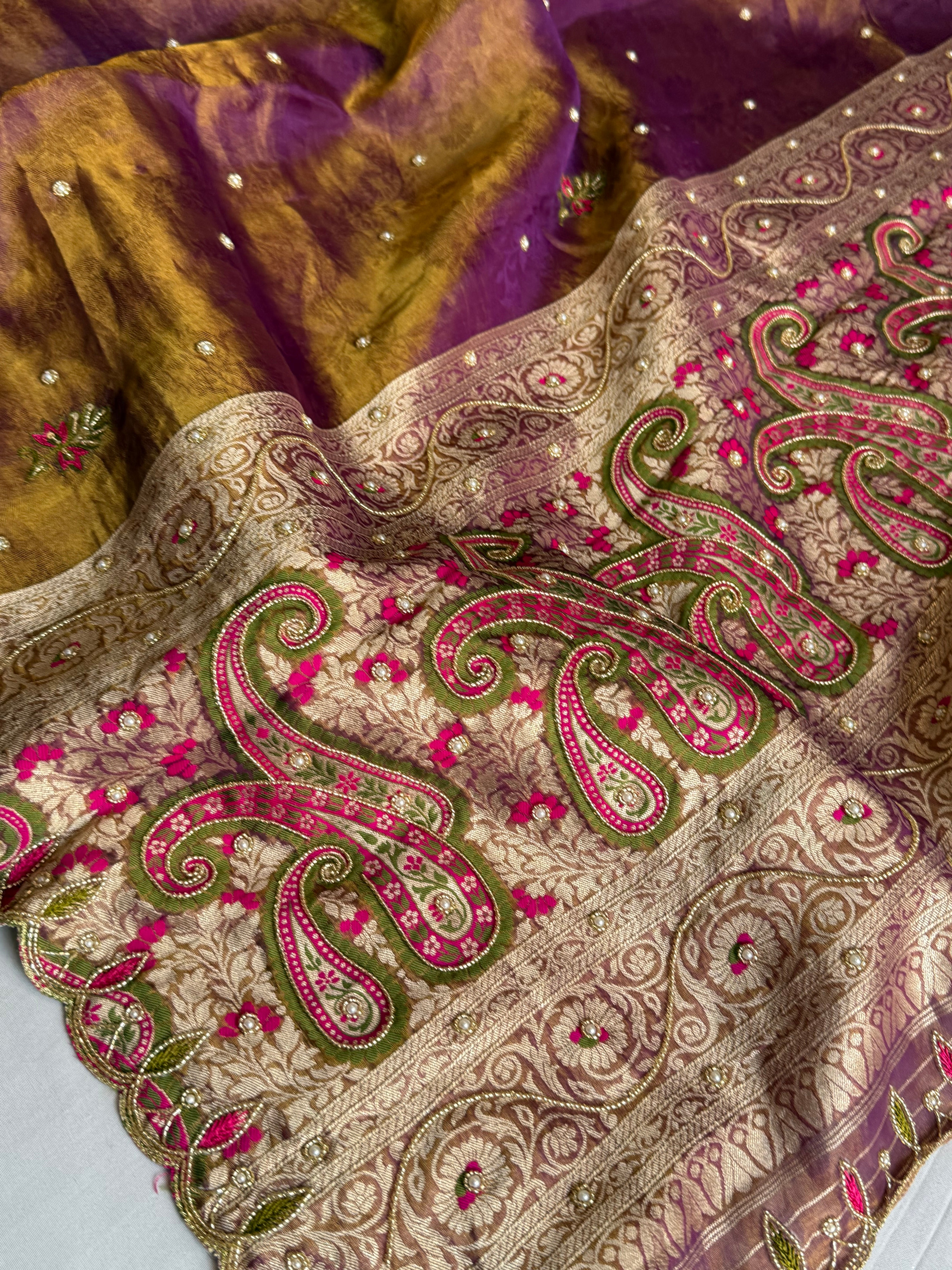 Copperish purple dhup chao effect tissue tanchoi jamevar meenakari pallu hand embroidered saree