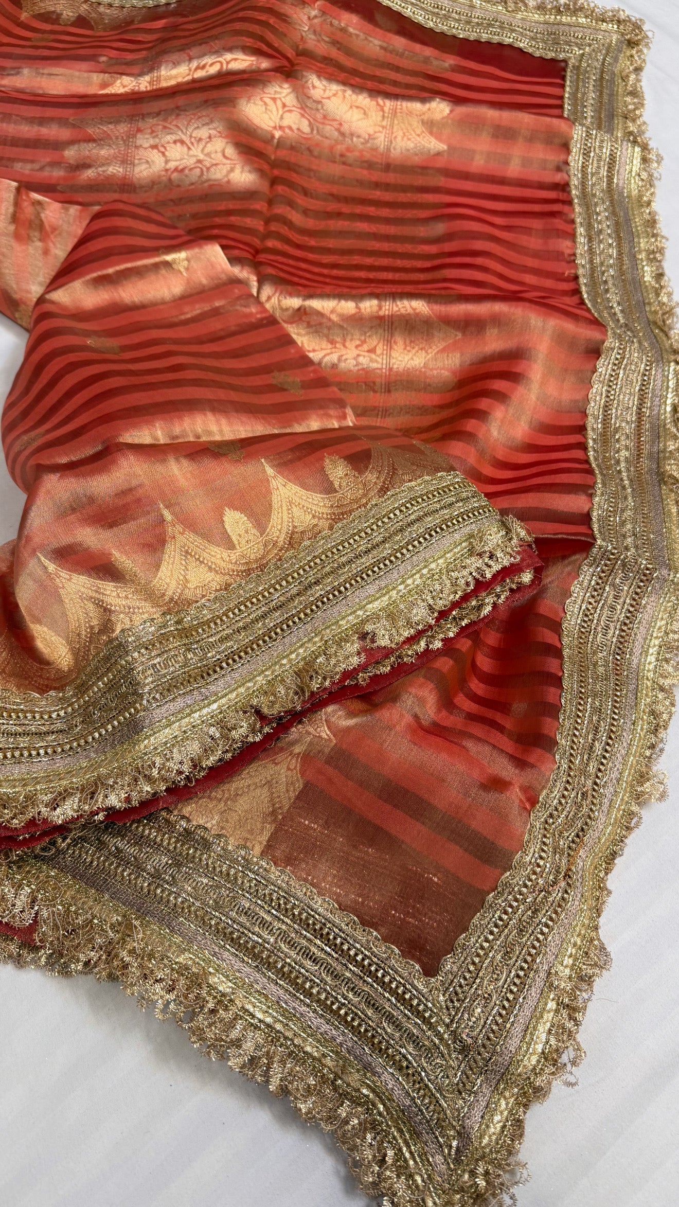 Maharani rust red tissue silk striped kadhwa saree