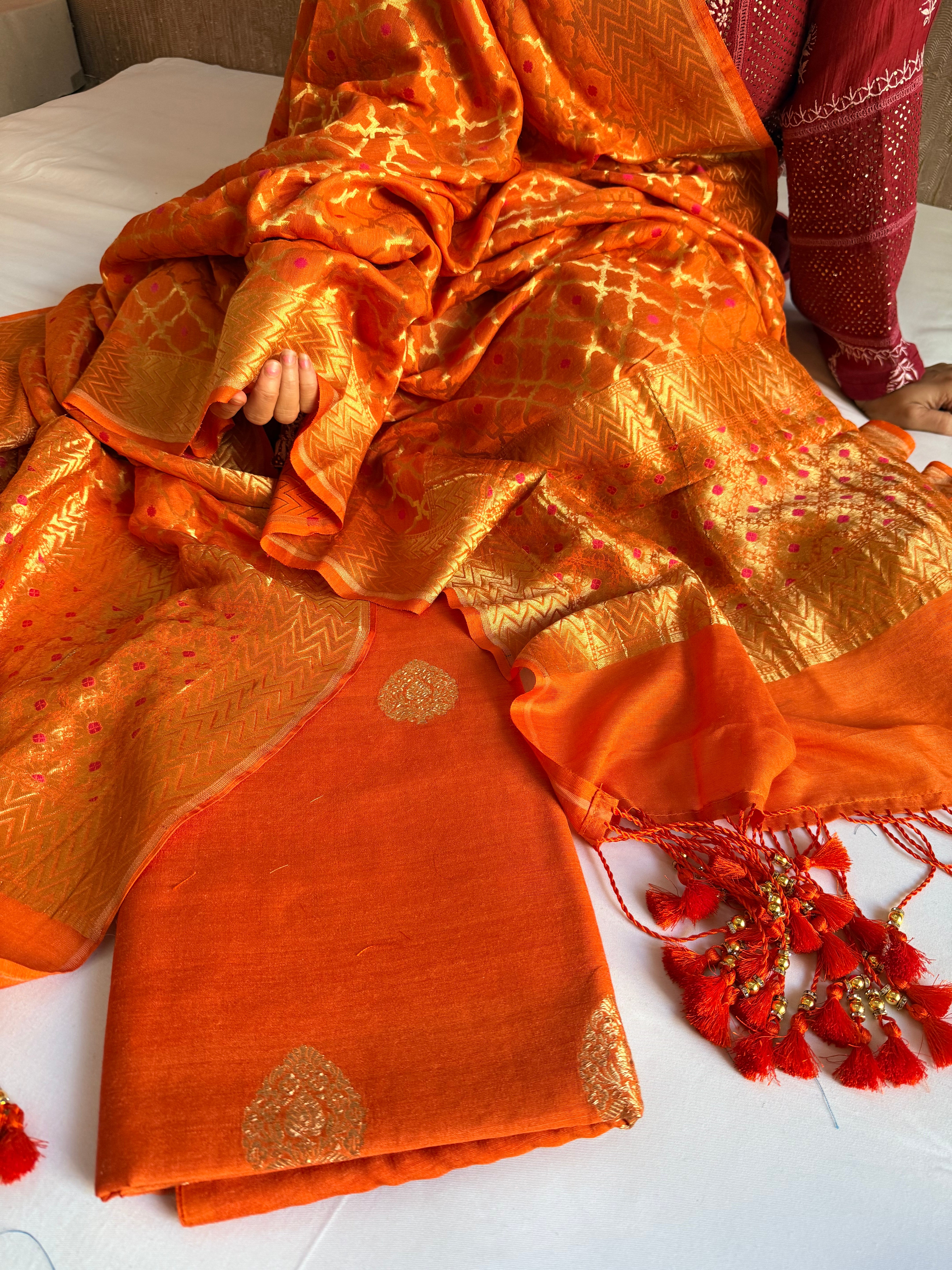 Moonga silk kadhwa kurta paired with gorgette duppata with latkans