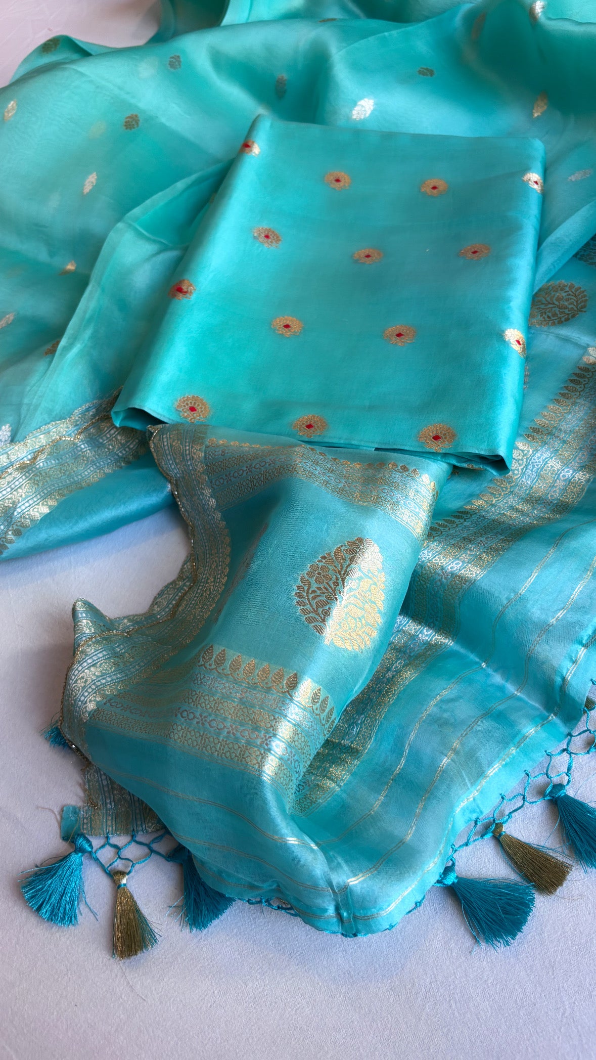 Banarasi firozi blue kora silk hand embroidered scalloped suit sets