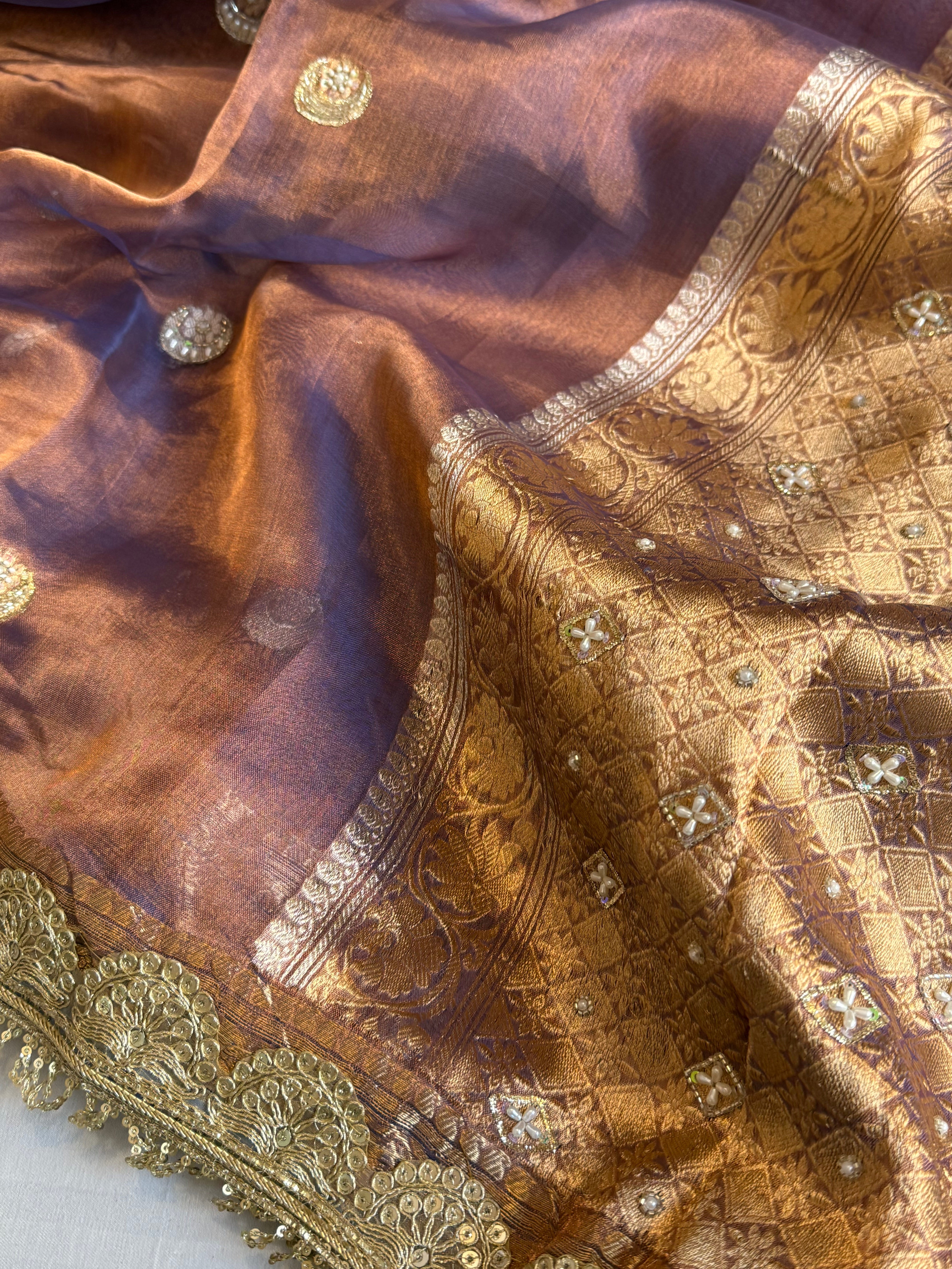 Chand tara copperish blue dhup chao effect tissue silk hand embroidered saree