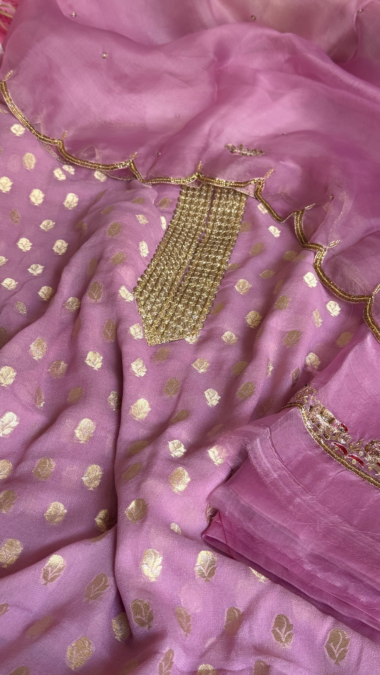 Dusty pink banarasi gorgette kadhwa buti kurta paired with toy hathi motif hand embroidered scalloped kora duppata